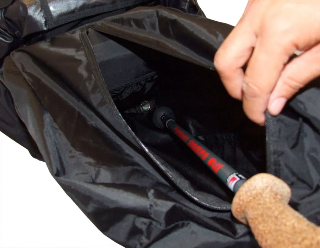 Holder for telescopic trekking poles built into the rear pocket