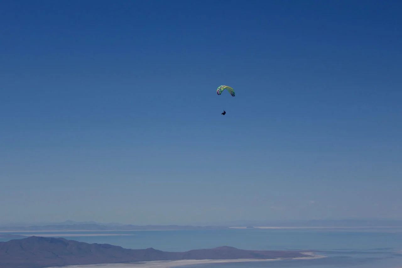 Calef soaring above the “V” launch with the Great Salt Lake in the distance, photo Ryan Dunn.