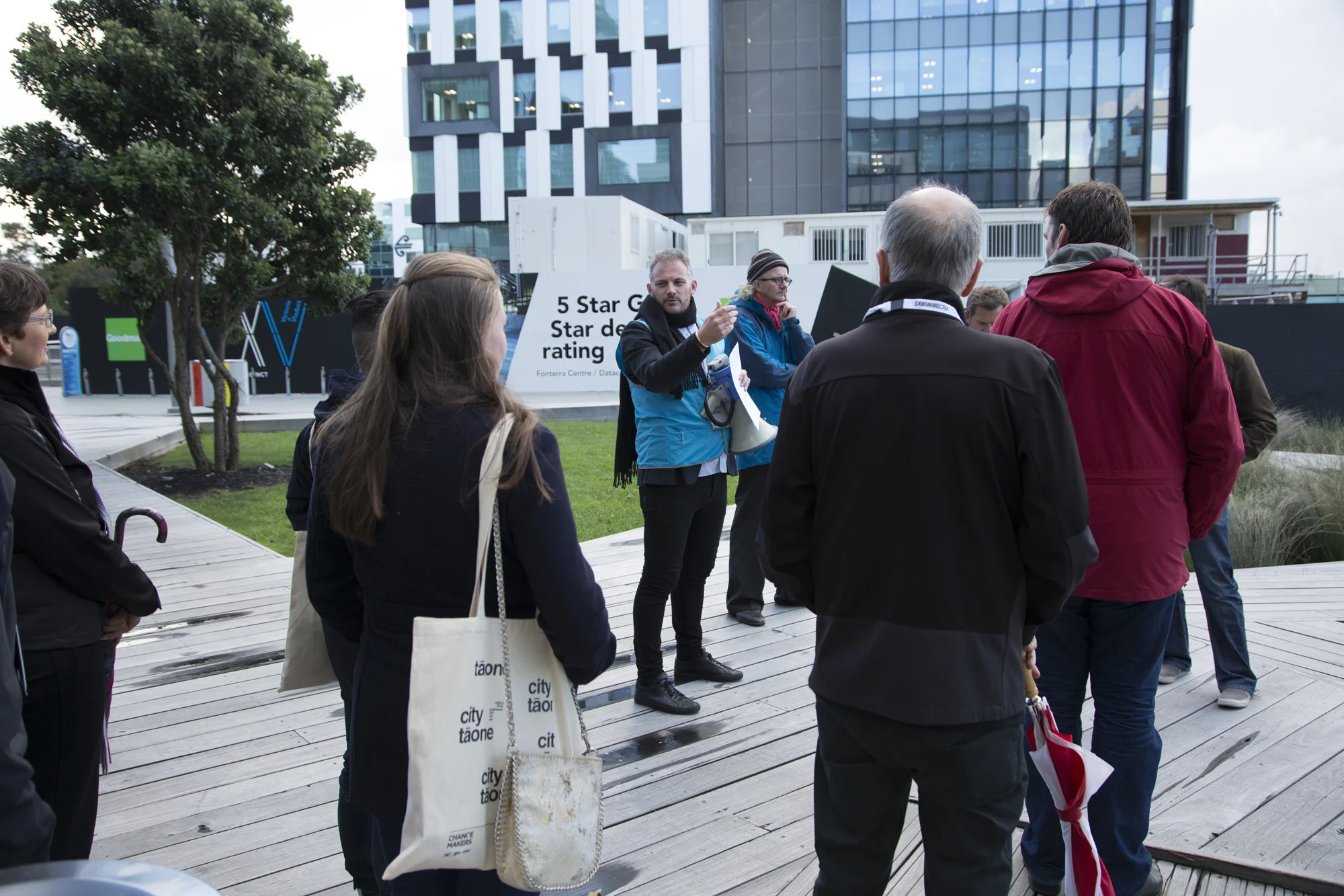 Henry Crothers (LandLAB) talks to delegates on the walking tour of Wynyard Quarter.