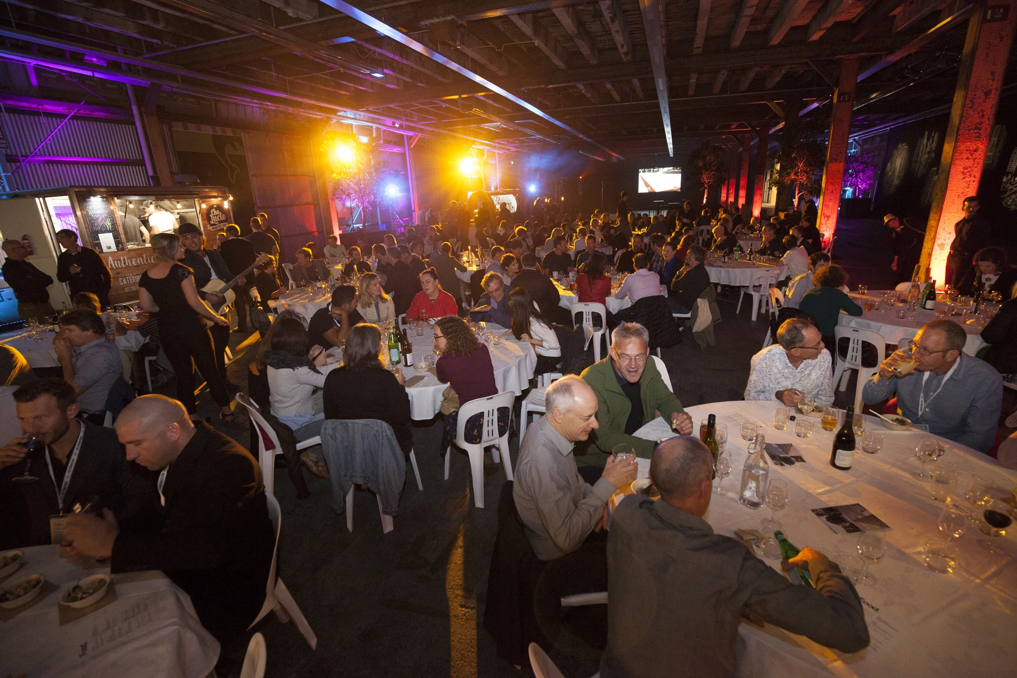 Conference dinner held at Shed 10 - with food trucks and street entertainment bringing the big space to life.