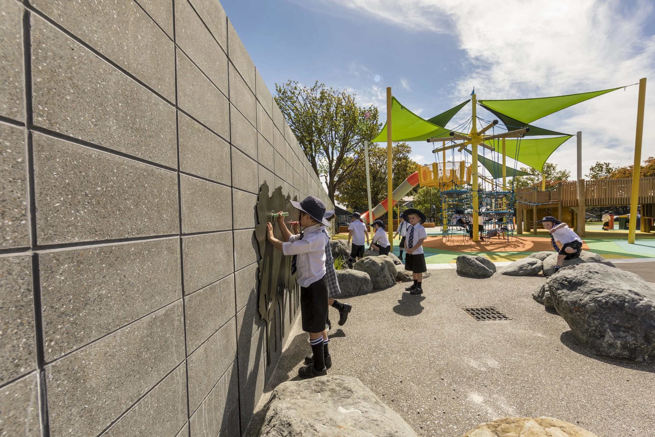 The two metre boundary wall is crammed with "play value" features, and was built using Firth’s honed blocks from their Architectural 20 series.