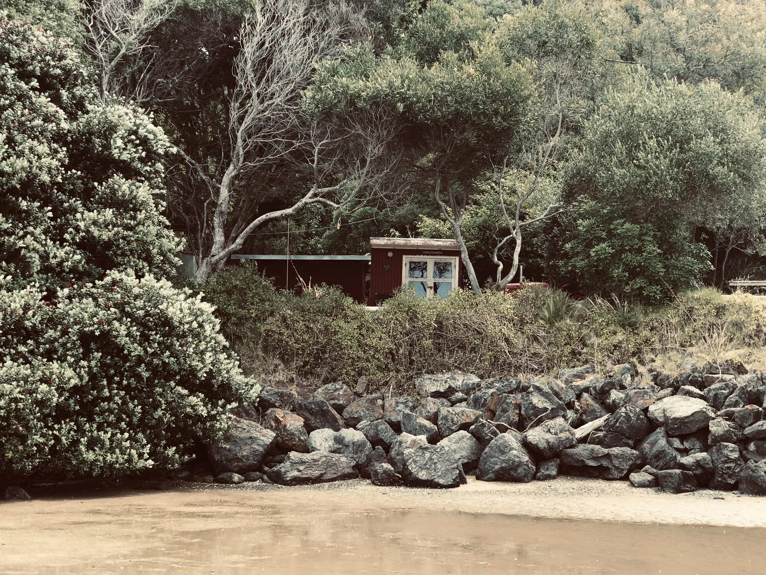 A classic kiwi bach at the Mangawhai Heads estuary in Northland.