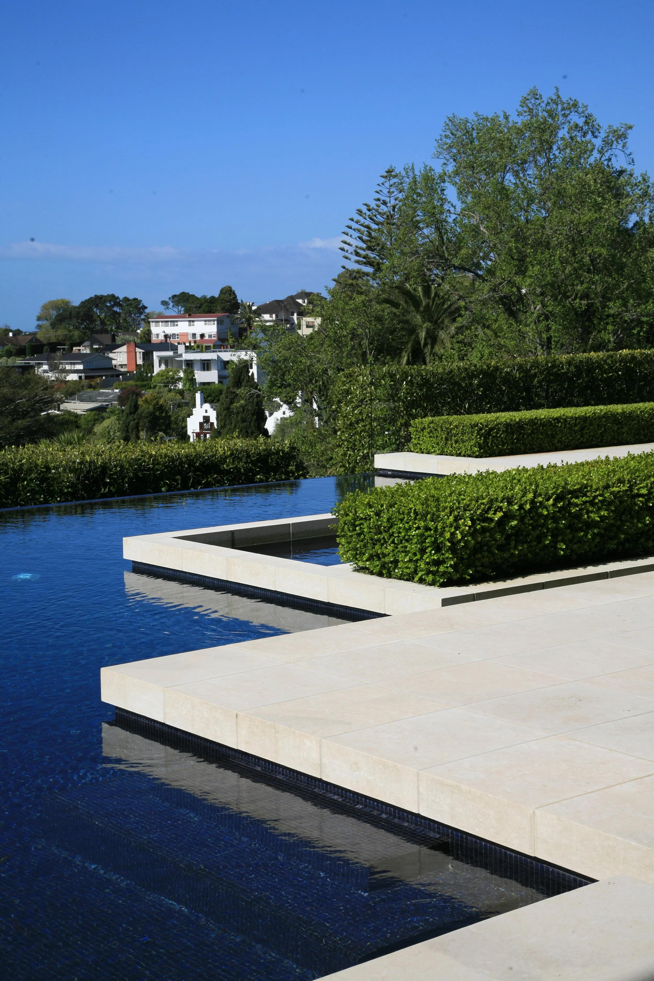 Attention to detail will create architectural coherence. Robin Shafer suggests choosing paving materials and copings to relate back to the details on the building.