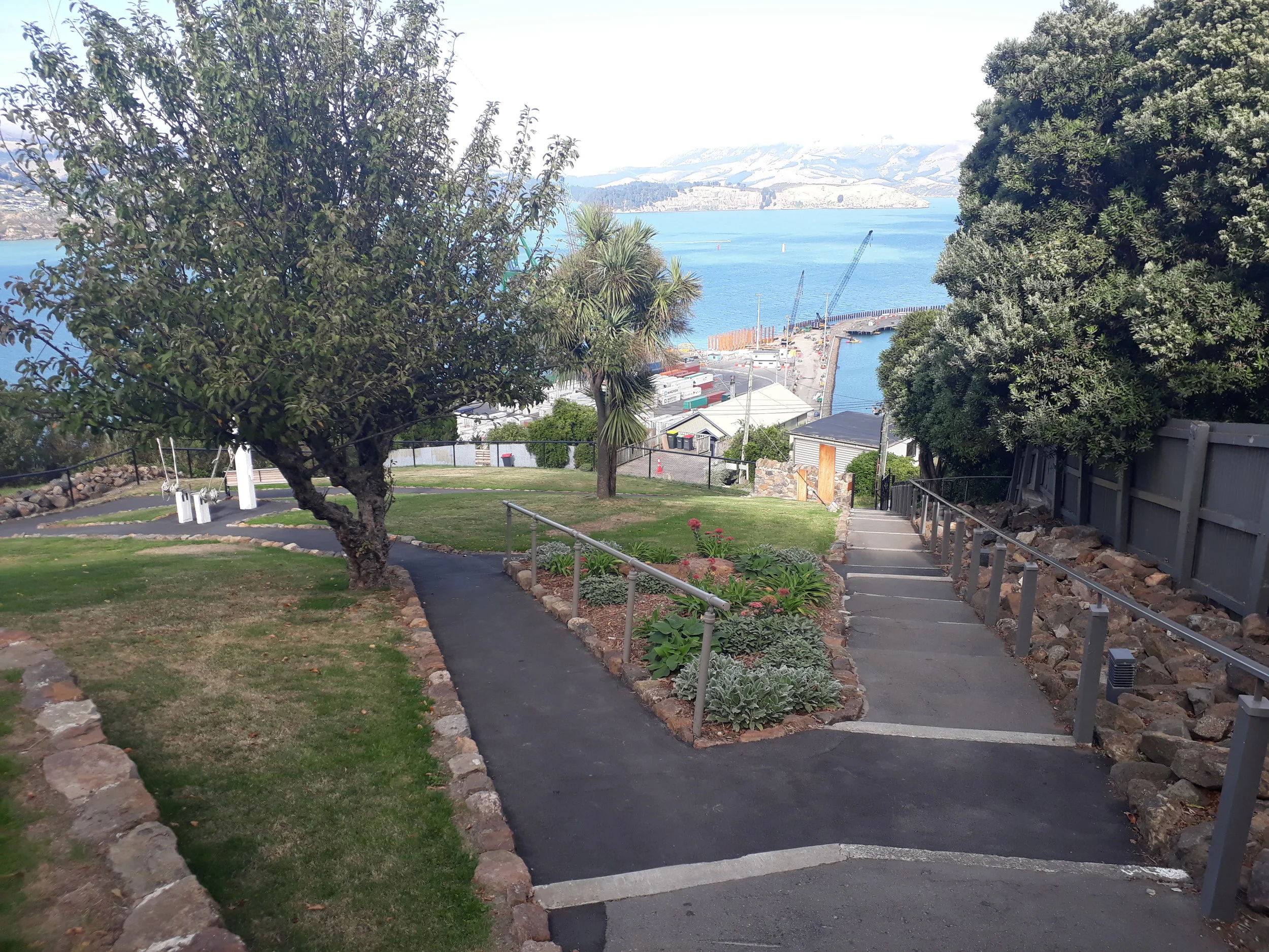 The grounds provide a peaceful vantage point overlooking the harbour.