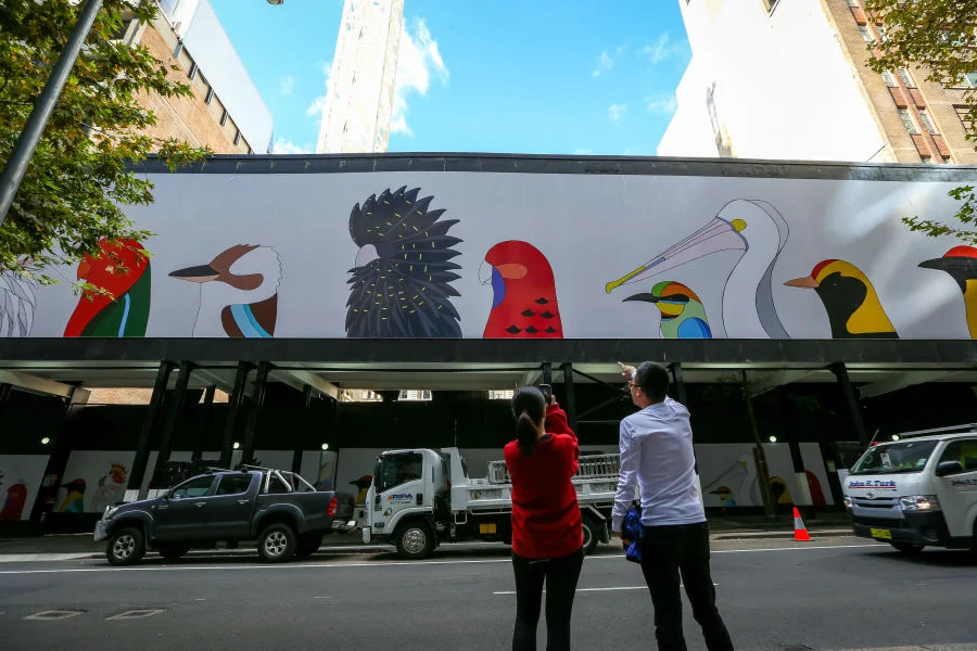 Birds of Australia by Camila De Gregorio and Christopher Macaluso of illustration and design studio, Eggpicnic. The studio produces fine art prints and toys to raise funds and awareness about wildlife conservation. This work was chosen by the City of Sydney for its creative hoardings project.