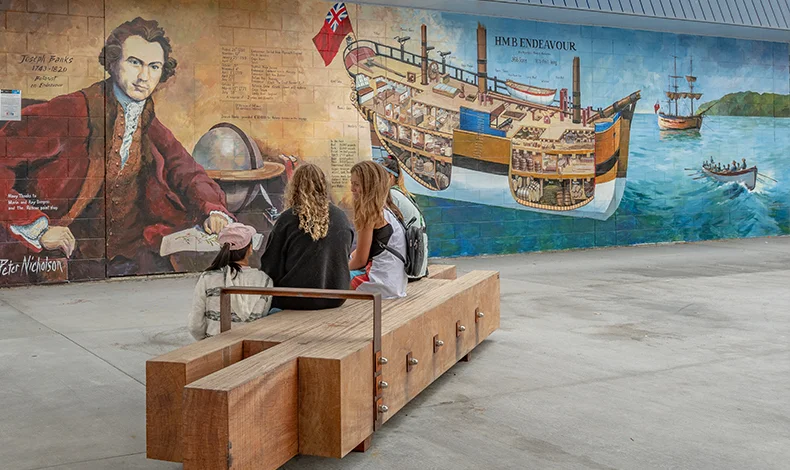 Whitianga Art group member, Peter Nicholson, created this mural on the wall of the Mainly Casual building immediately next to the new Whitianga town plaza in Albert Street. It depicts the Endeavour ship and botanist Joseph Banks (a member of the Endeavour’s crew).