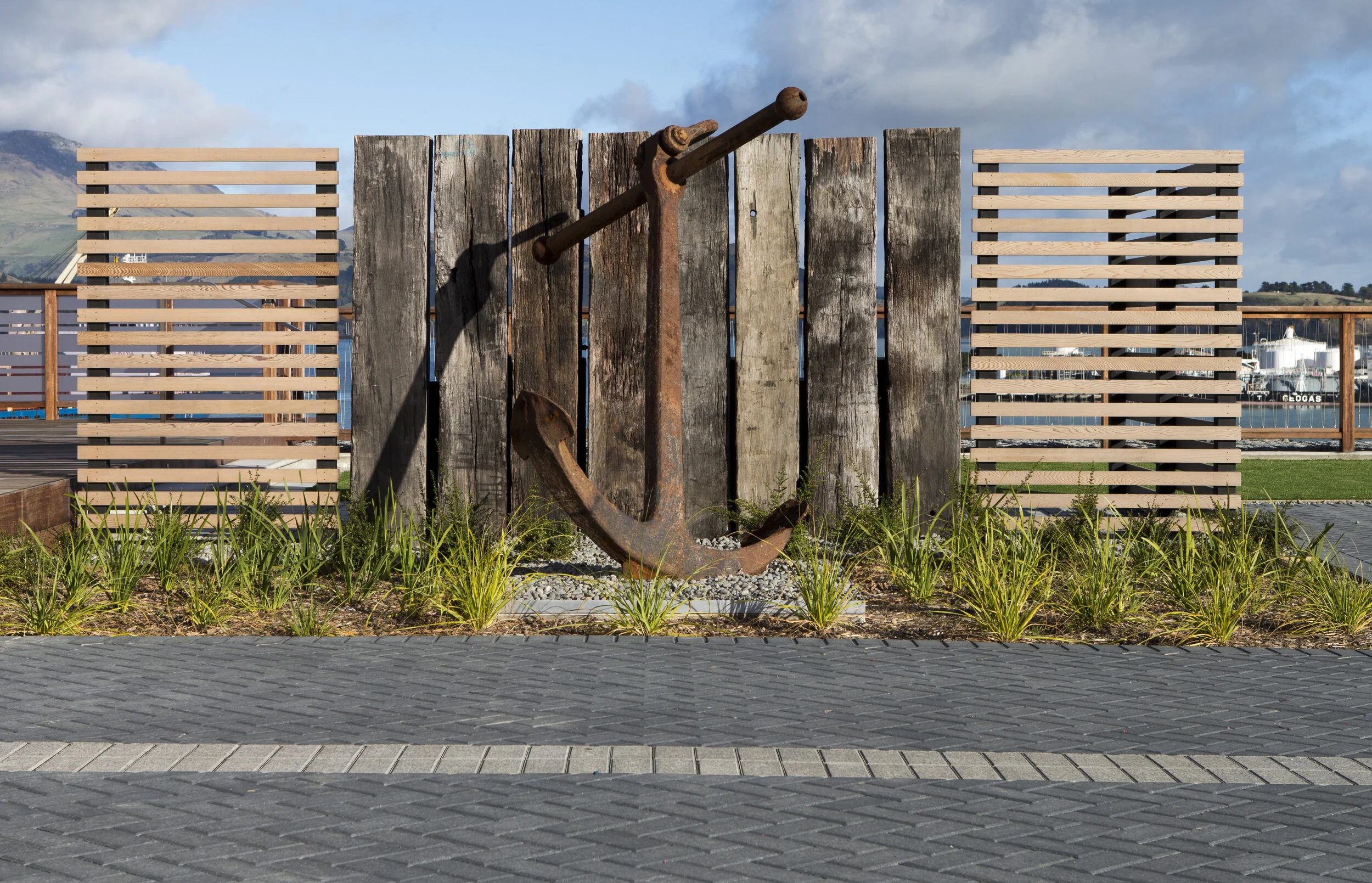An anchor was also donated and takes pride of place in the main yard, lit up at night with the lights of the working port behind. Photo by CMG Studios