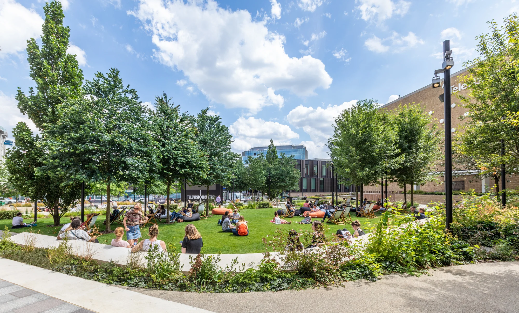 Multi-stem trees and richly planted areas separate the private terraces from communal spaces, and informal seating is also abundant.