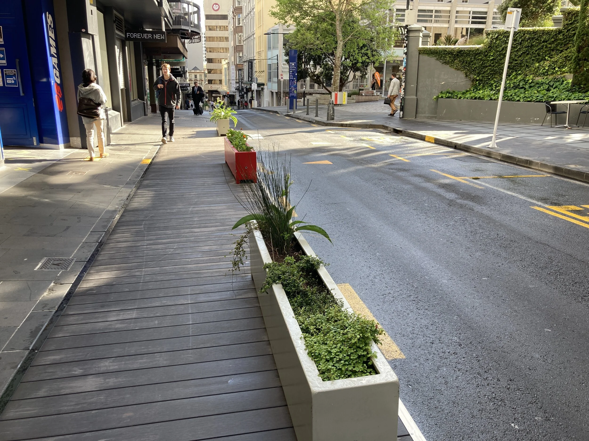 High St uses planter boxes and wide footpaths.