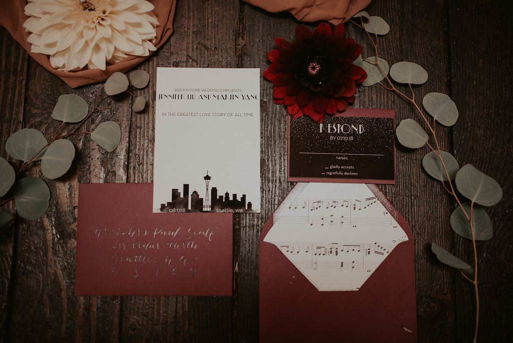 The stationery from Love Fern Design featured the Seattle skyline, teamed with the Lala Land movie poster font, and because no detail was left undone the envelope liner even featured sheet music from 'City of Stars'.