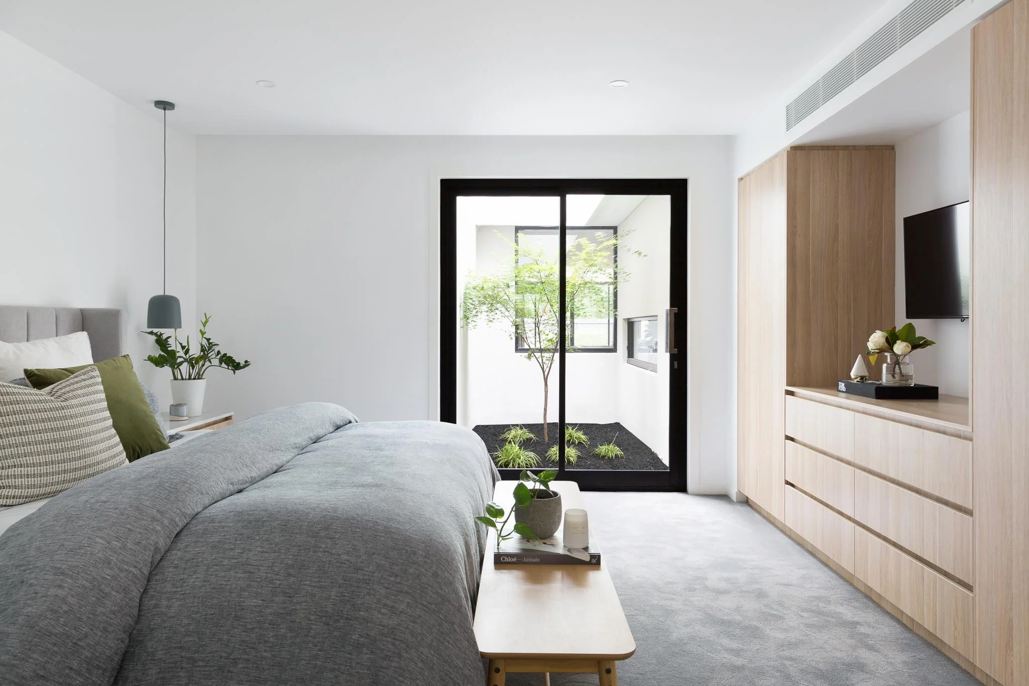 While we aren't seeing the entire bed and wardrobe, we infer the space that they occupy within the scene.