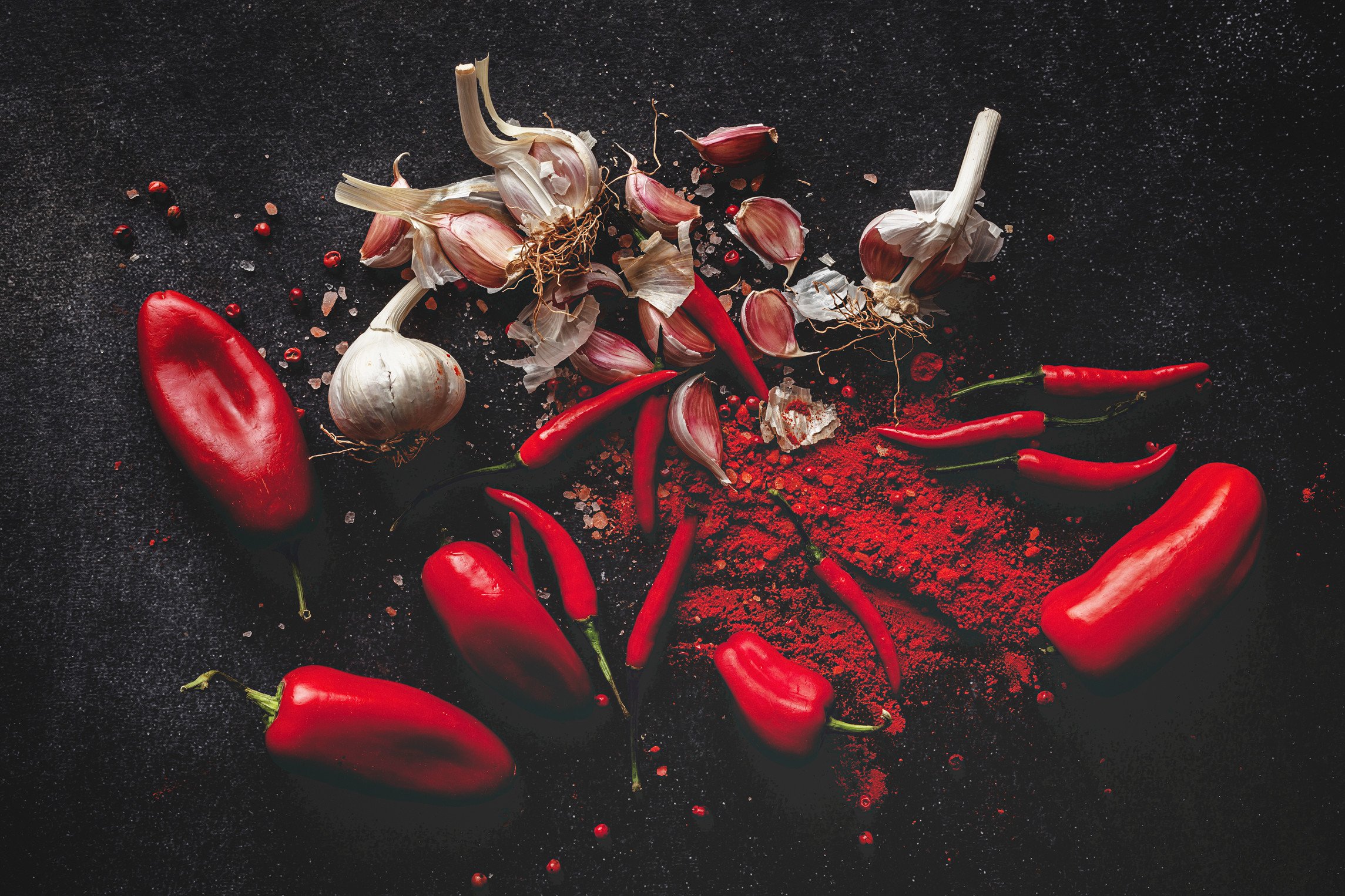 StockFood_12600117_L_Fresh_red_and_spicy_chilli_peppers_on_dark_background.jpg