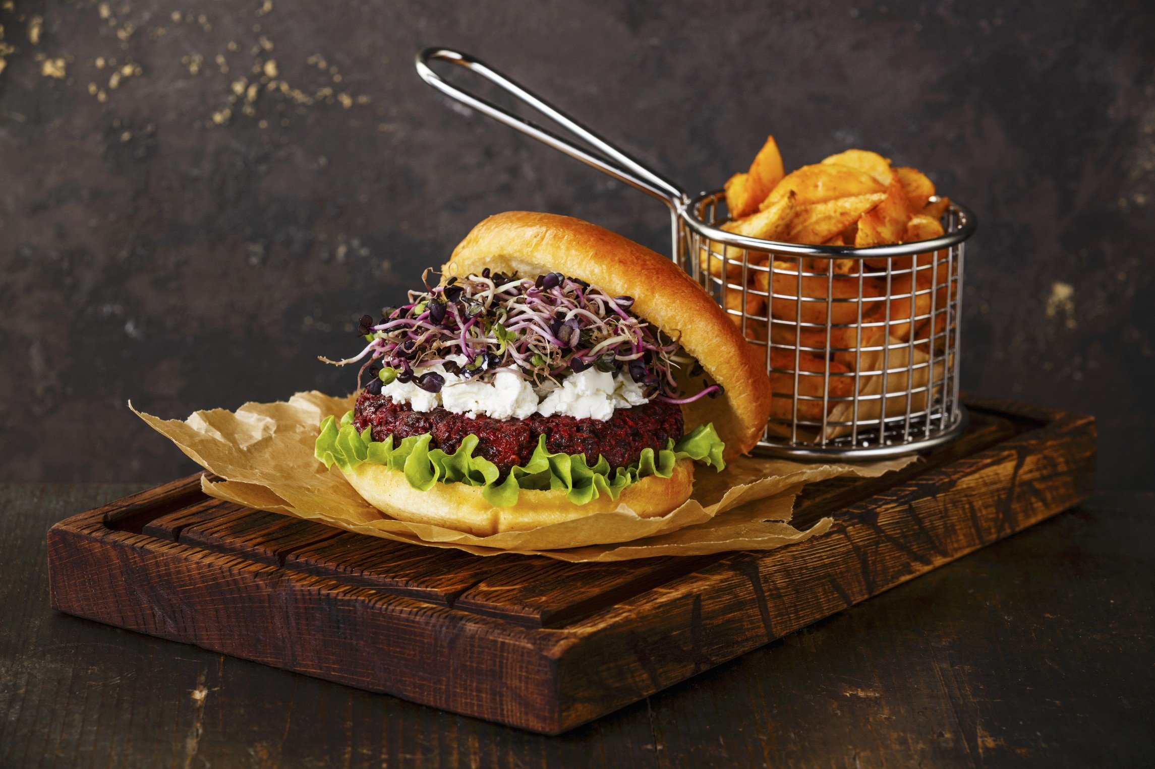 StockFood_12292189_L_Beet_burger_with_soft_cheese_radish_sprouts_and_potato_wedges_on_dark_background.jpg