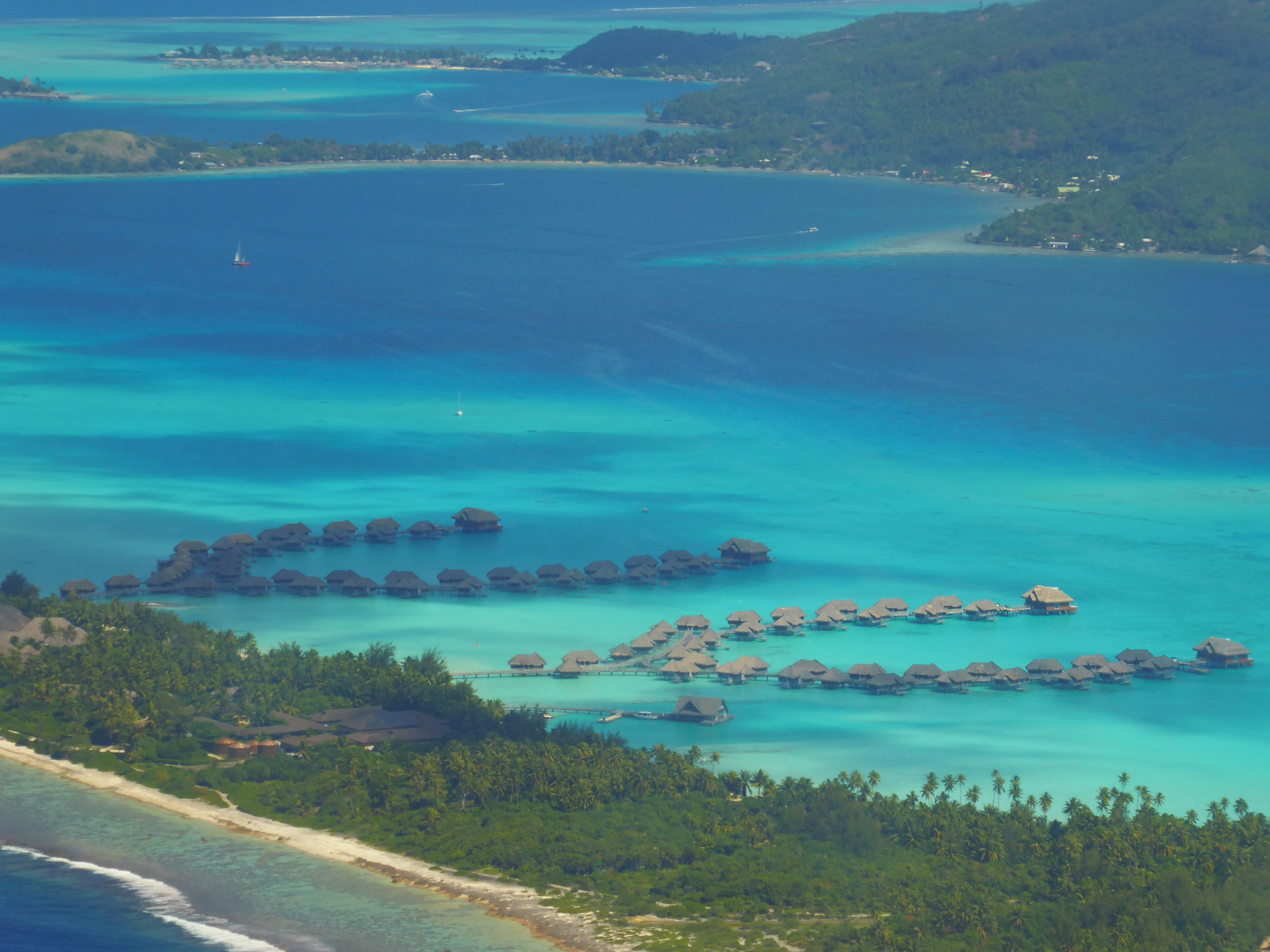 Eastern side of Bora Boar on the way in, with InterContinental Bora Bora Resort over the water bungalows in the foreground on Motu Piti A'au