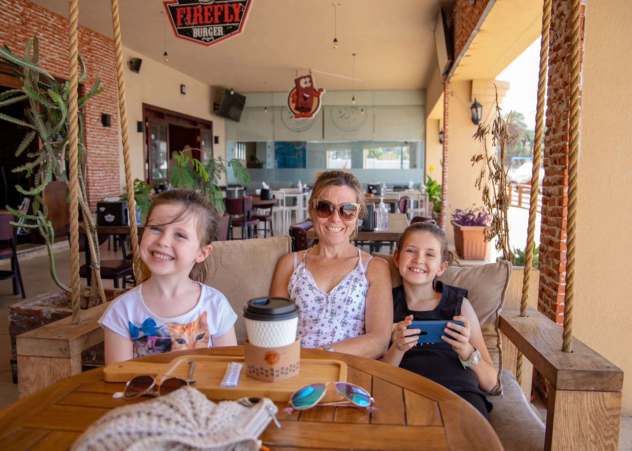Girls enjoying a swing and coffee
