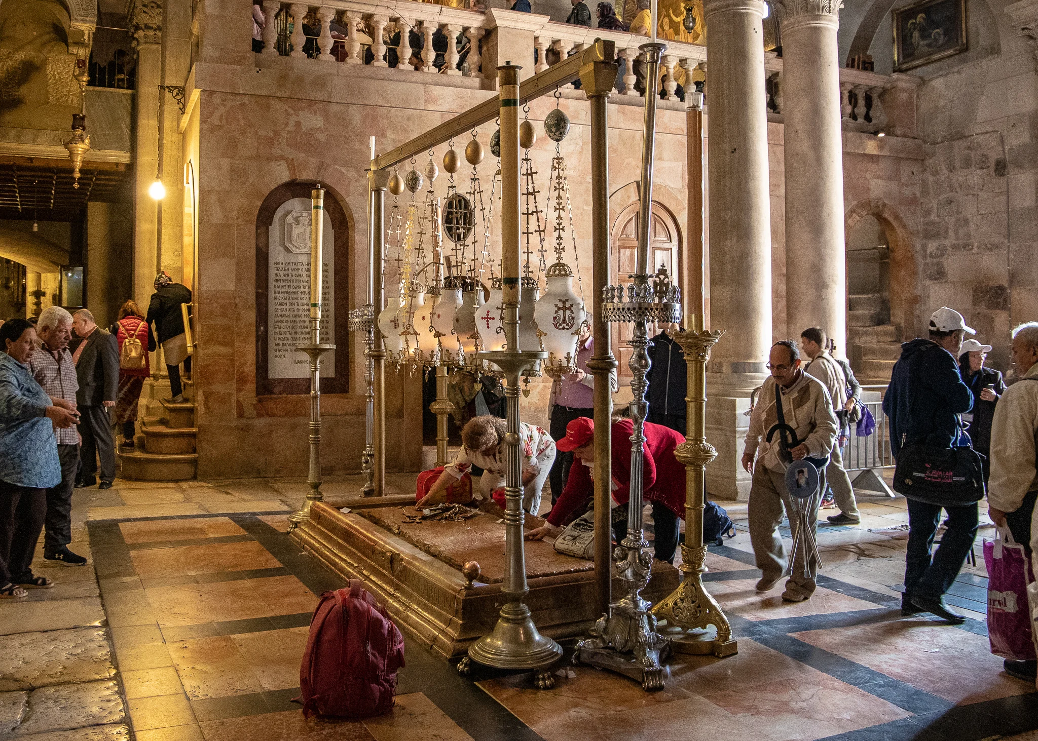 The faithful kissing the Stone of Unction
