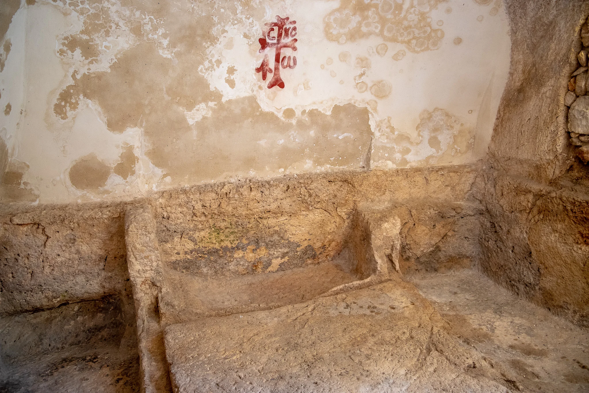 Inside the tomb with Byzantine cross grafiti