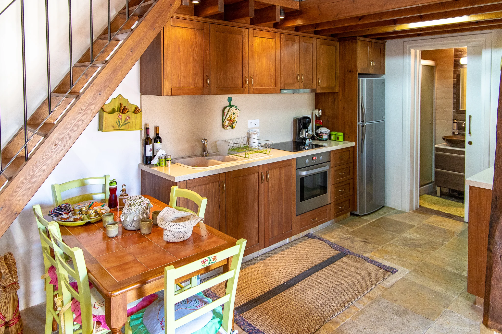 Kitchen and stairs leading up to the loft