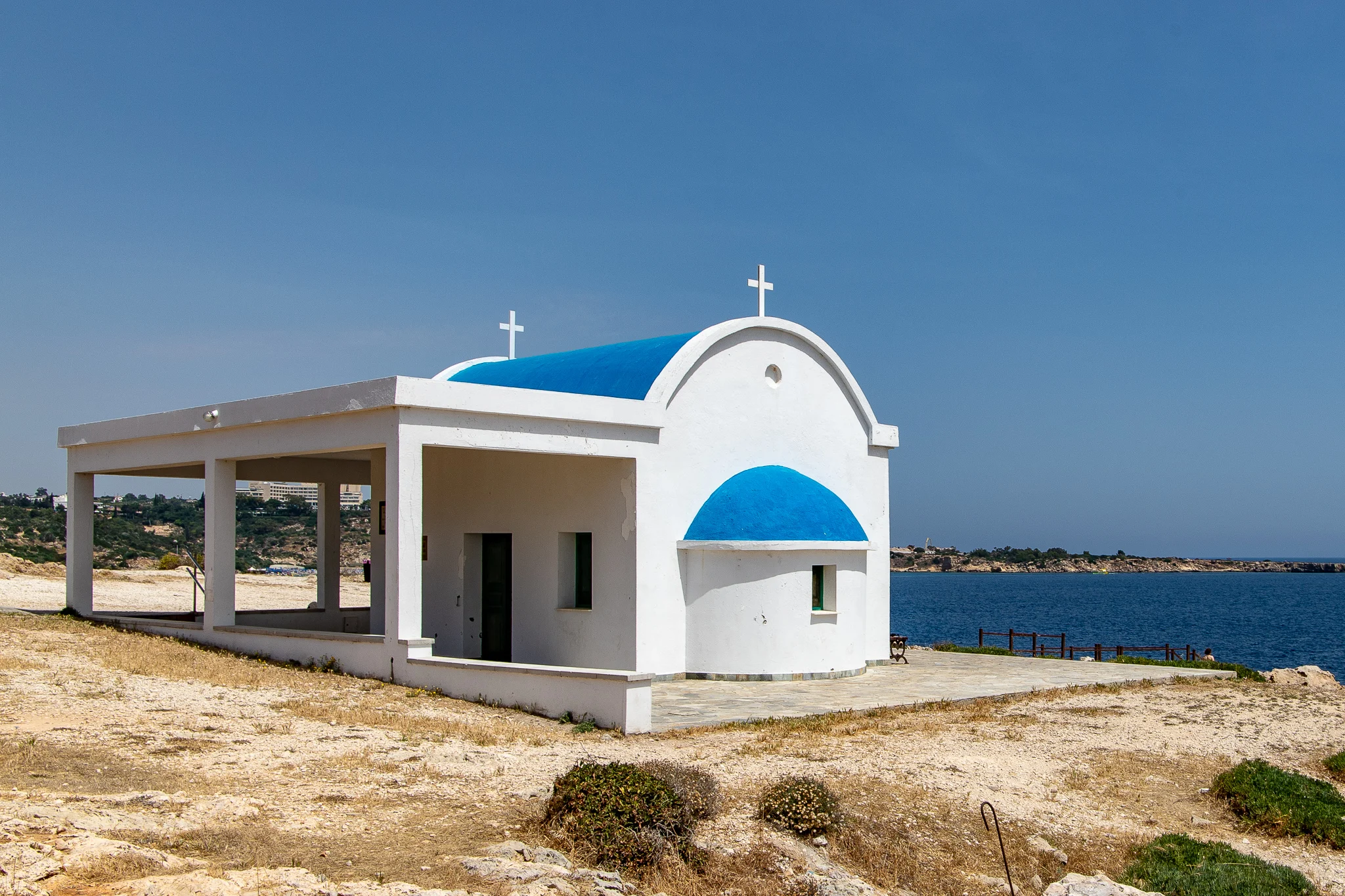 The Agioi Anargyri Church idyllically situated above some sea caves