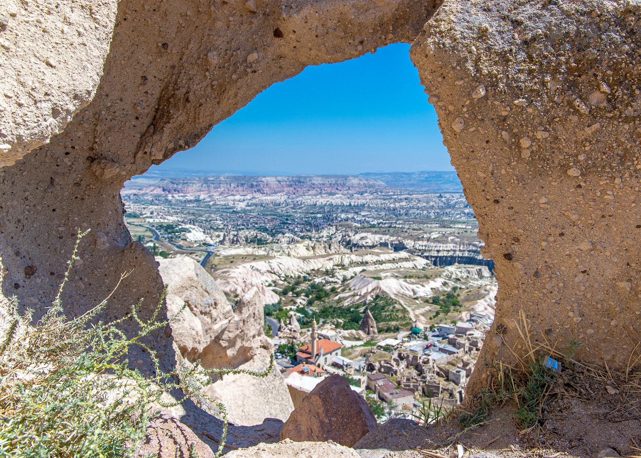 View down to Uchisar town and Goreme off in the distance