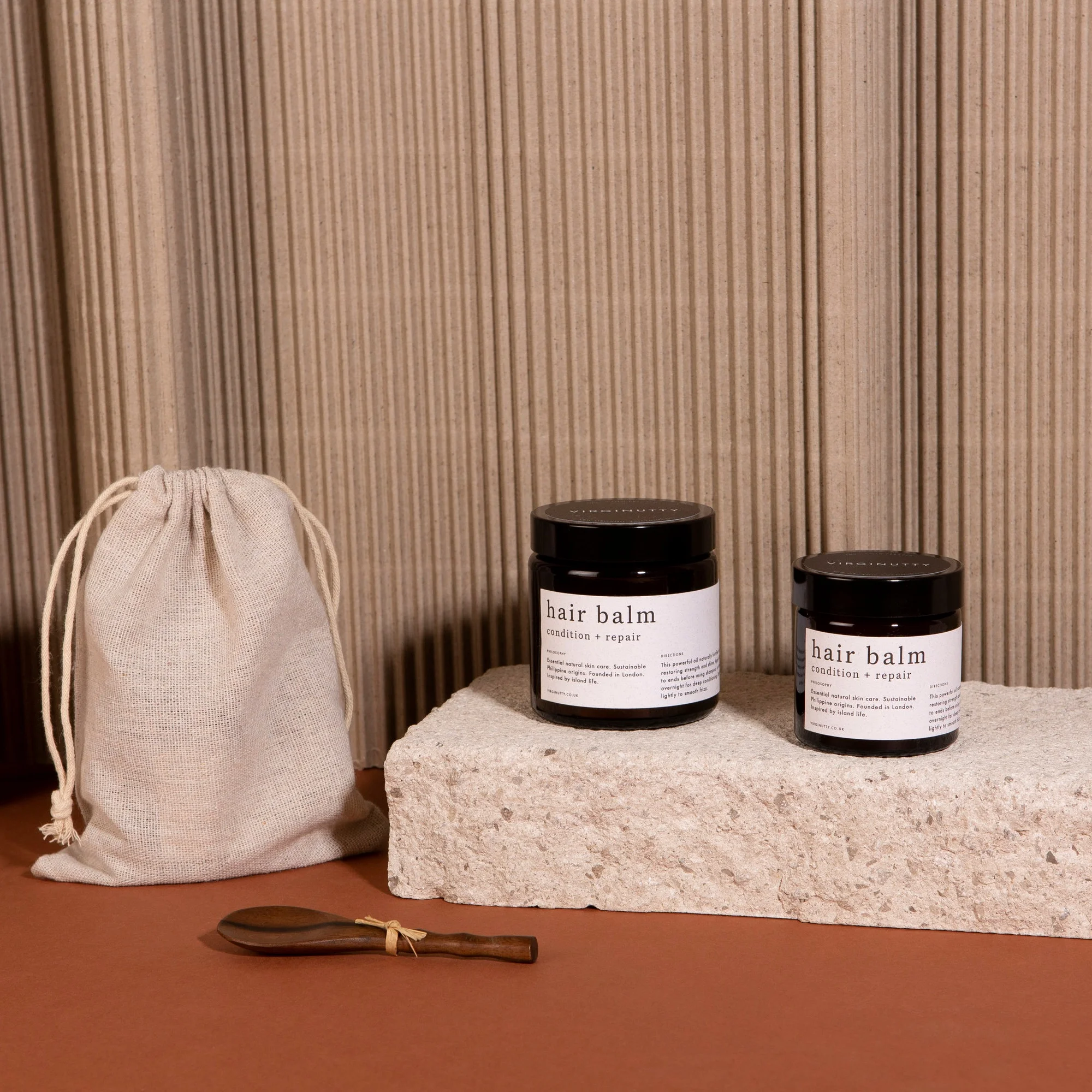 Virginutty+Hair+Balm+Coconut+Oil+Products+on+Stone+Plinth.jpg