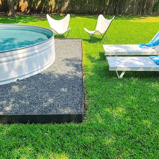 Tag a friend 👉 to lounge with you next to this stock tank pool 😎☀️🙌
📷: @stonewayswimclub 
#stocktankpool #stocktank #hillbillyhottub #summer #backyard #backyardpool #lawn #backyarddesign
