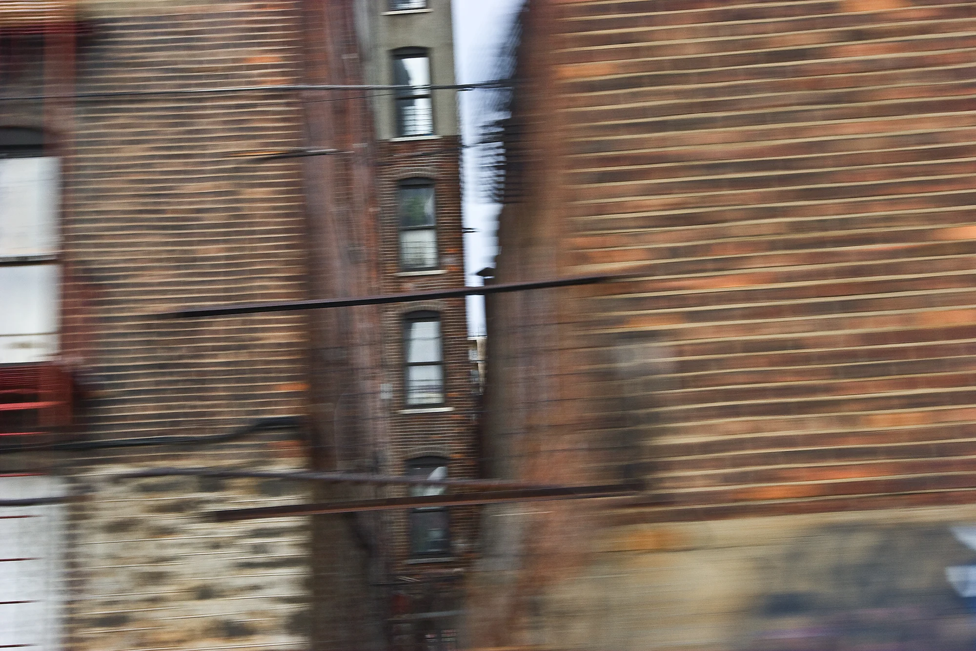 Round Trip #7 “Round Trip” portray’s the artist’s view from the train as she rides back and forth from the suburbs to the city of New York. In a dream-like, poetic style, this series offers Miracolo’s subtle musings on the passages we humans make across time and space.