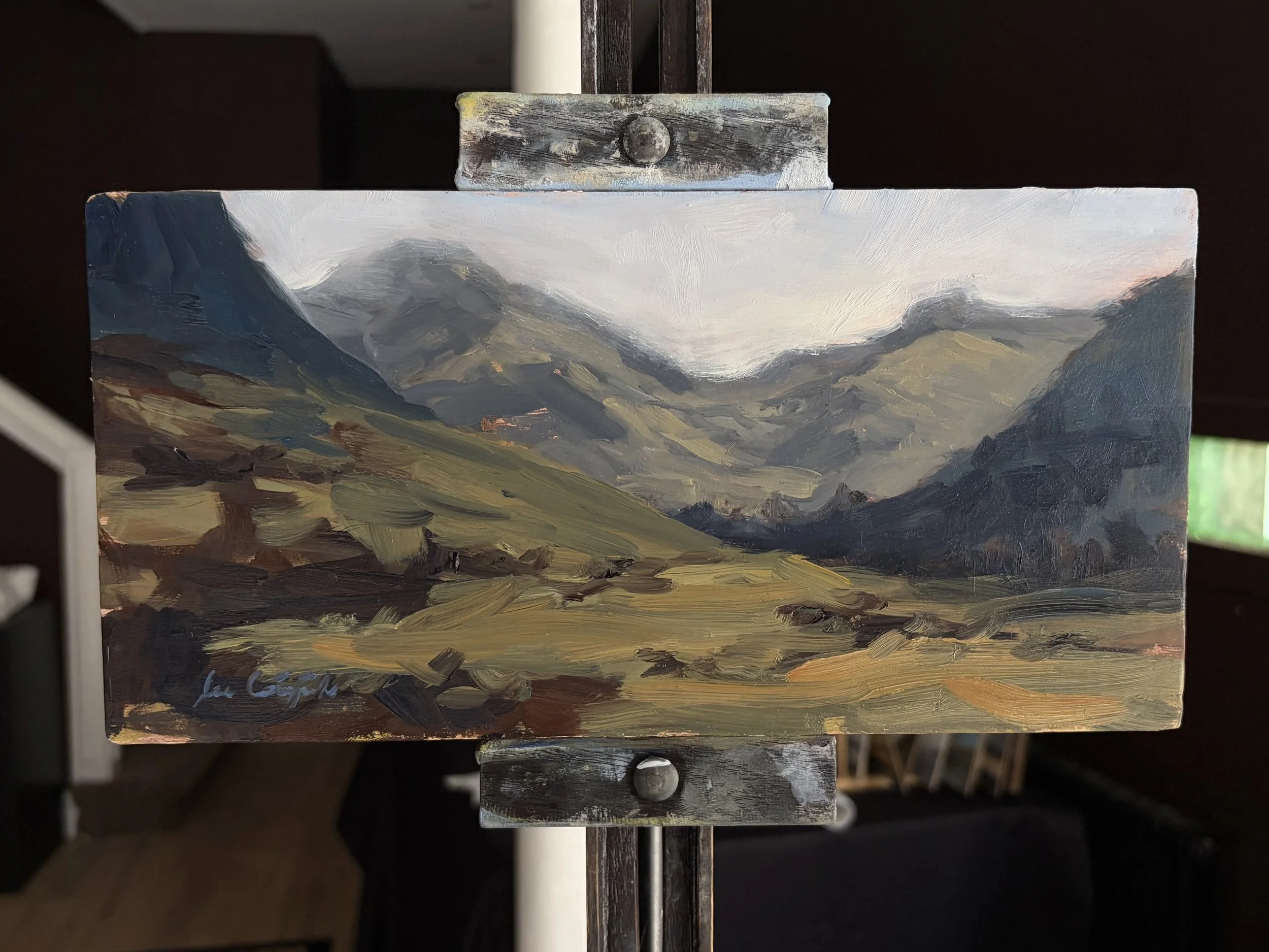 Original oil painting of Glen Nevis displayed on a studio easel by Scottish artist Lee Craigmile.
