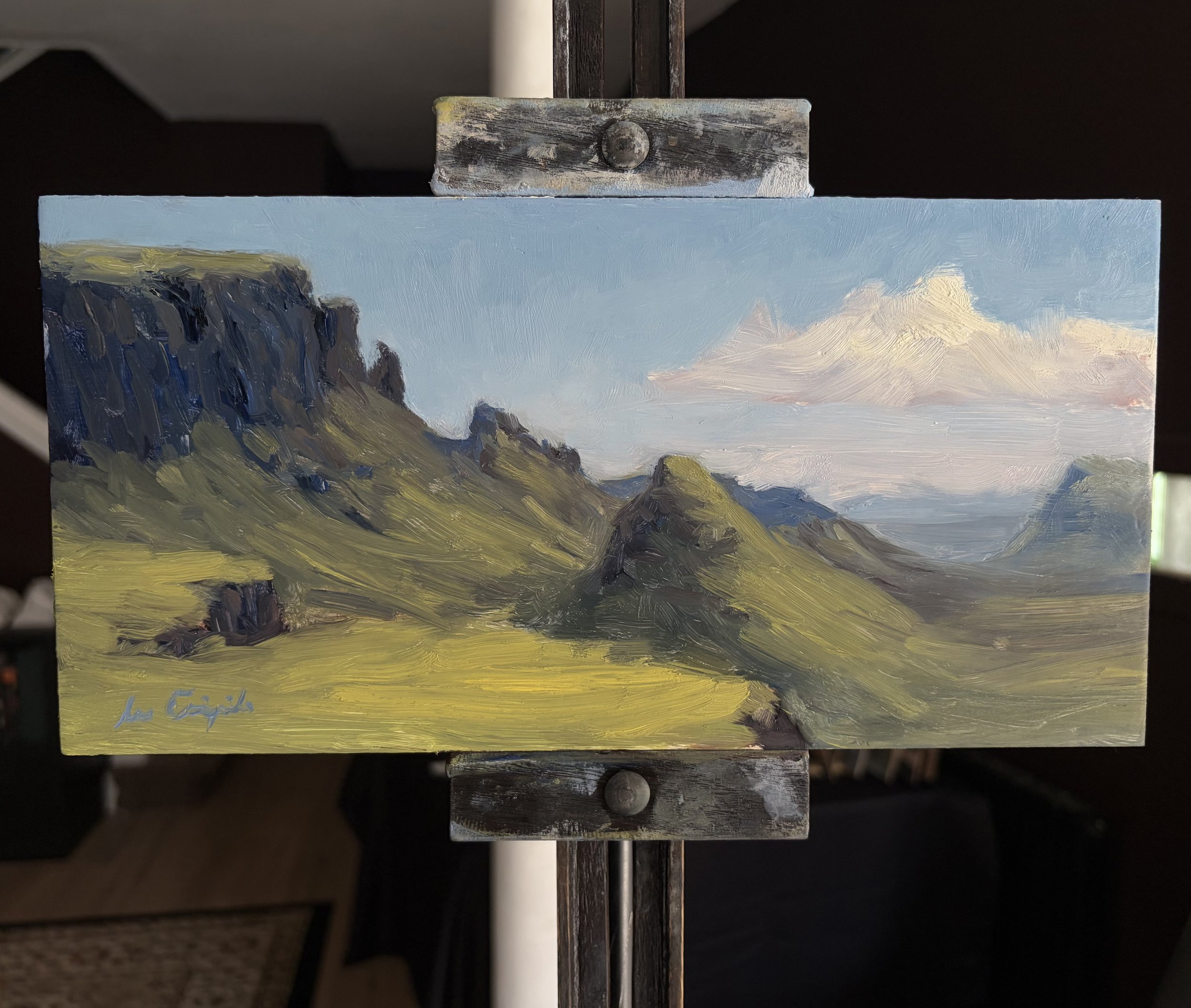 Original oil painting of the Quiraing displayed on a studio easel by Scottish artist Lee Craigmile.