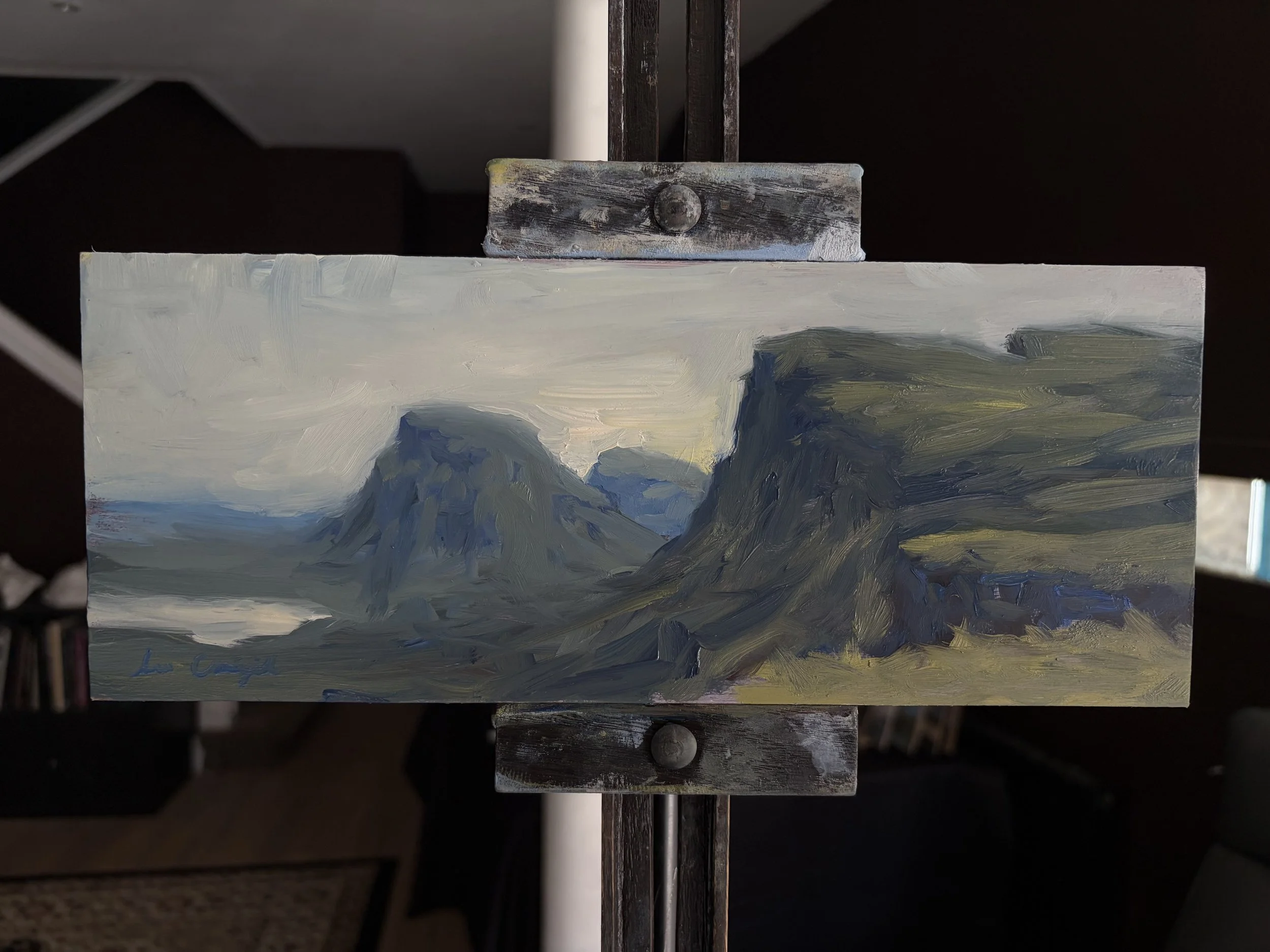 Original oil painting of the Quiraing displayed on a studio easel by Scottish artist Lee Craigmile.
