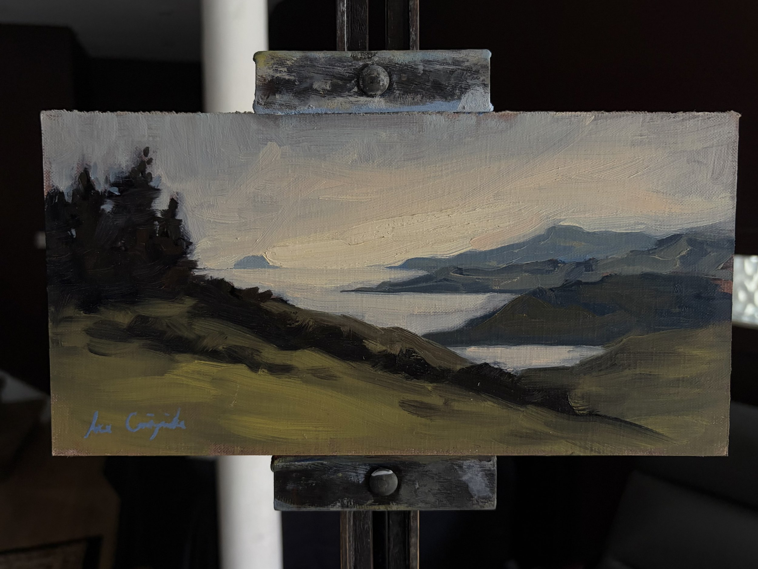 Original oil painting titled View from Cumbrae displayed on a studio easel by Scottish artist Lee Craigmile.