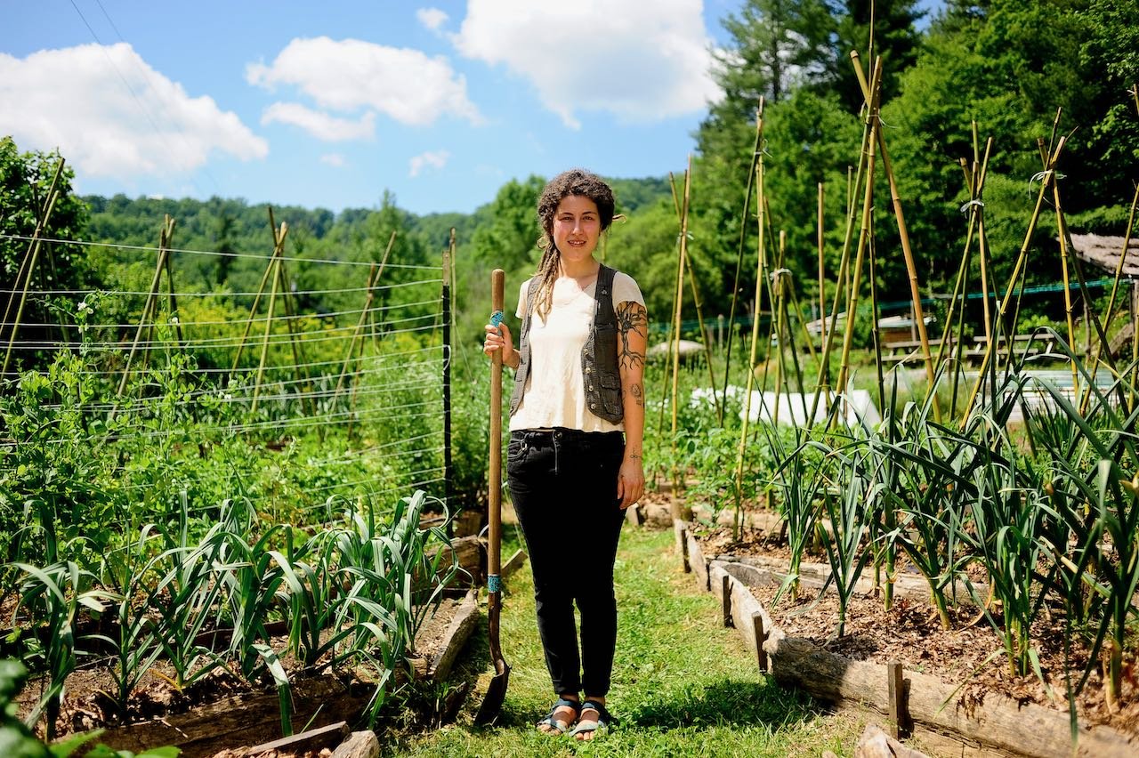 woman holding shovel in garden