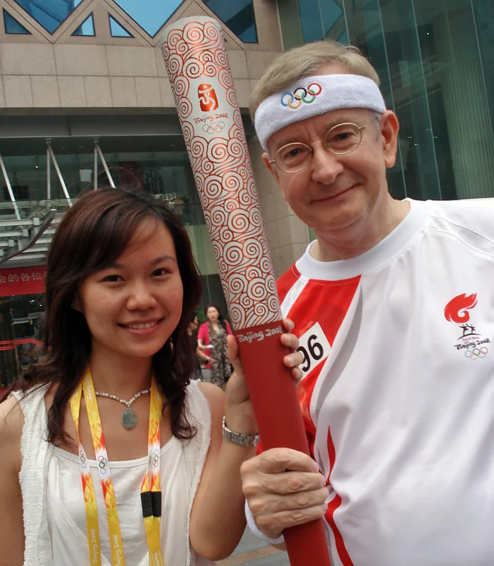 With Mavis Ma and my Olympic torch. This shot was taken shortly before we got on the buses to go to Tiananmen Square.