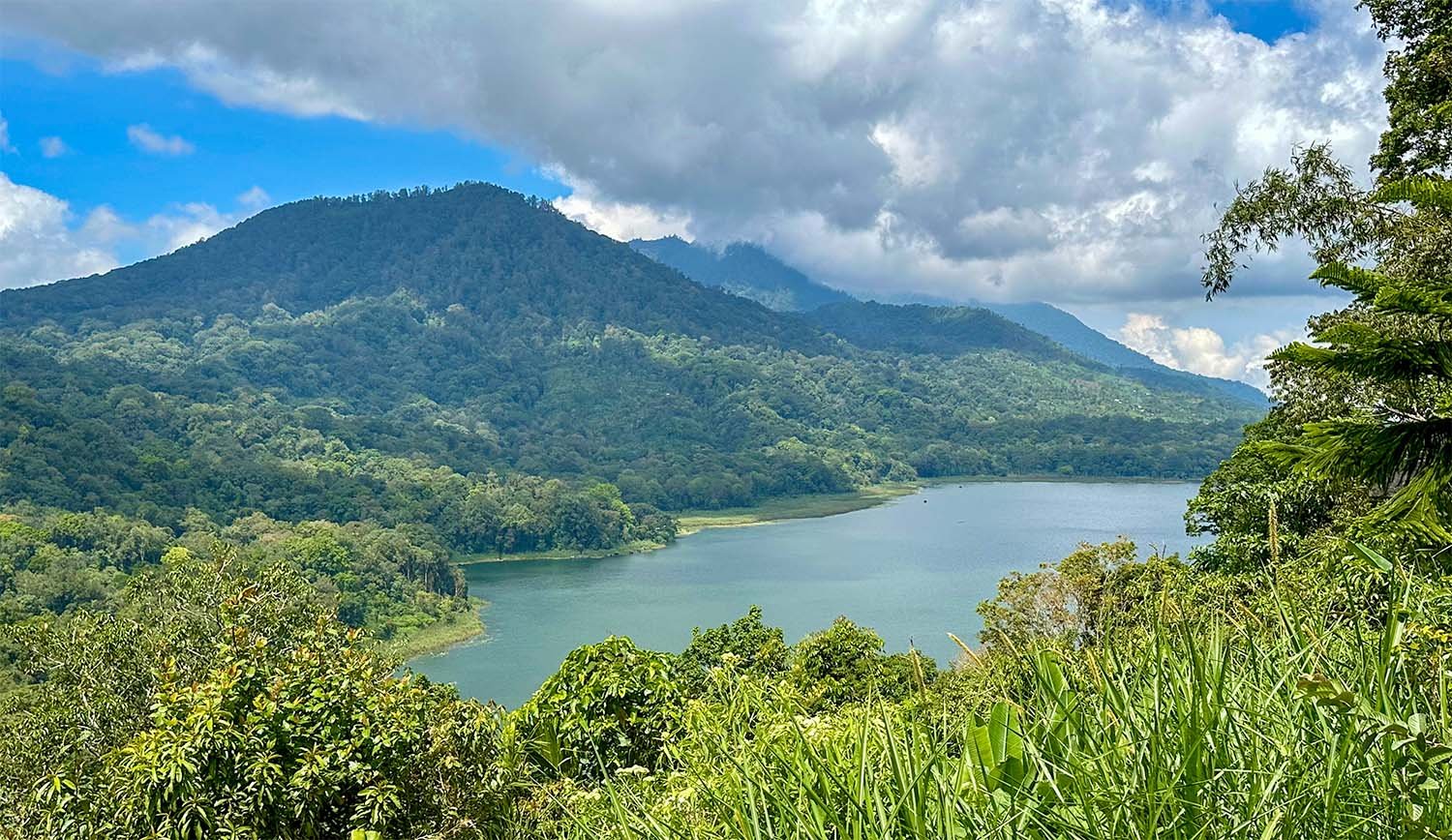 Wide view of Lake Tamblingan in North Bali taken from a nearby ridge.
