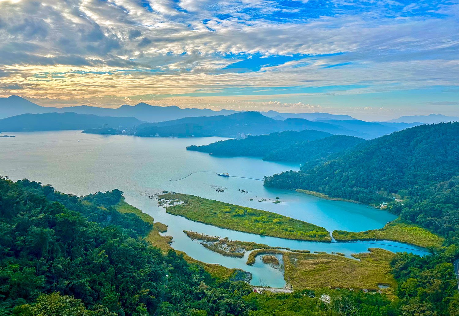 Semi-aerial view (taken from a cable car) of Sun Moon Lake surrounded by forested hills near Taichung, Taiwan,