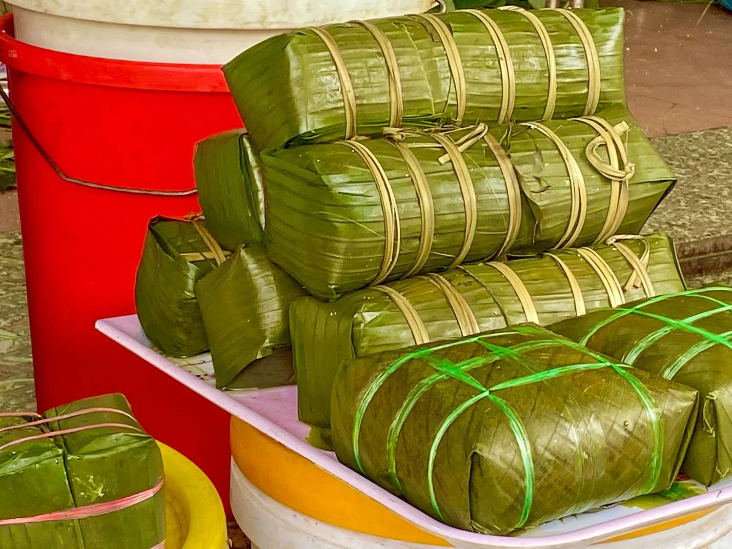 Close-up of a tray of wrapped Tet cakes ready for gift-giving in Vietnam.