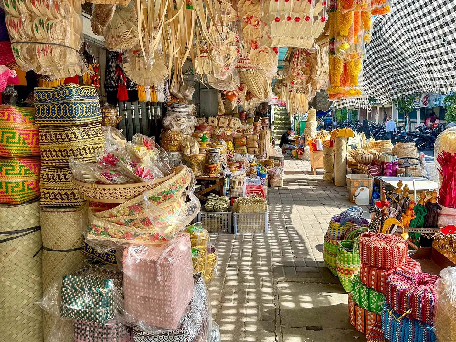 Interior view of part of the Singaraja traditional market in North Bali showing piles of handwoven baskets.