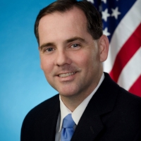Carlos M. Pomares Executive Director