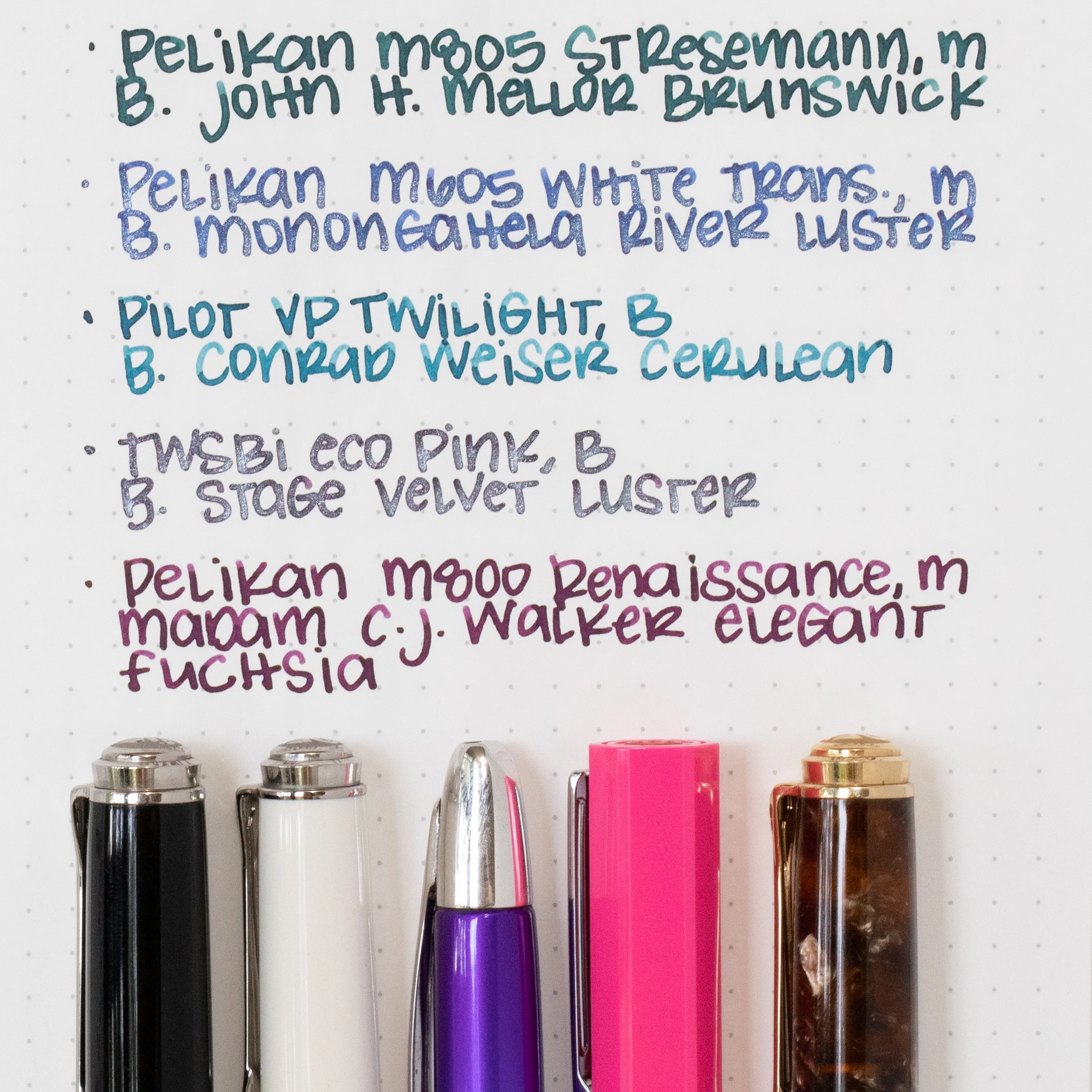 Left to right, Pelikan M805 Stresemann-M, Pelikan M605 White Transparent-M, Pilot Vanishing Point Twiligt-B, Twsbi Eco Pink-B, and Pelikan M800 Renaissance Brown-M.