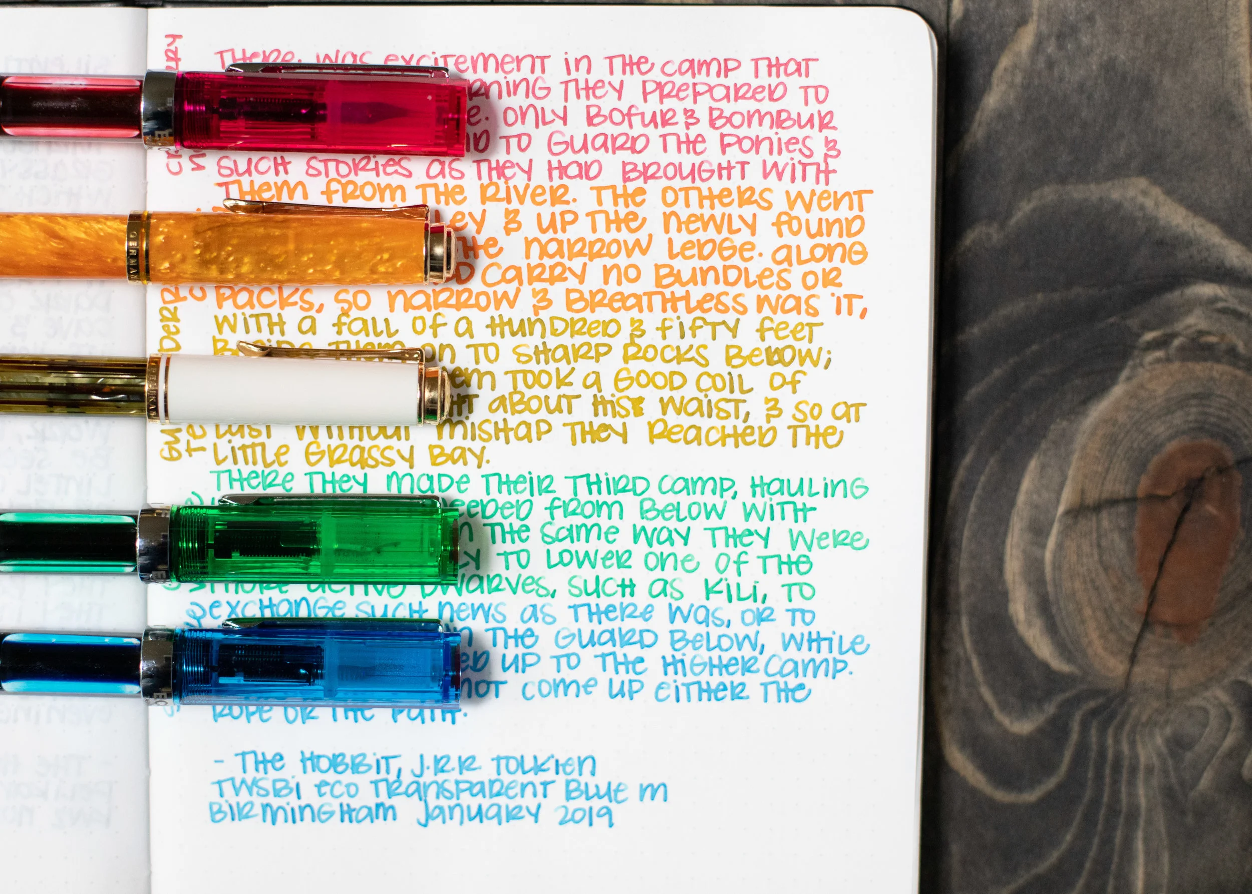 I used a Bond A5 (Tomoe River 68gsm). Top to bottom, I used: TWSBI Eco Blossom Red with a medium nib, Pelikan M600 Vibrant Orange with a medium nib, Pelikan M400 White Tortoise with a medium nib, TWSBI Eco Transparent Green with a medium nib, and a TWSBI Eco Transparent Blue with a medium nib. All of the inks had an average flow, but the consistency was a bit thin. I was talking to one of my kids while I was writing, I gestured to something, and ink came flying out of the pen all over the desk. I also had some issues with Relative Cadmium pouring onto the page while I was trying to write (you can see this in the Tomoe River writing sample shown above).