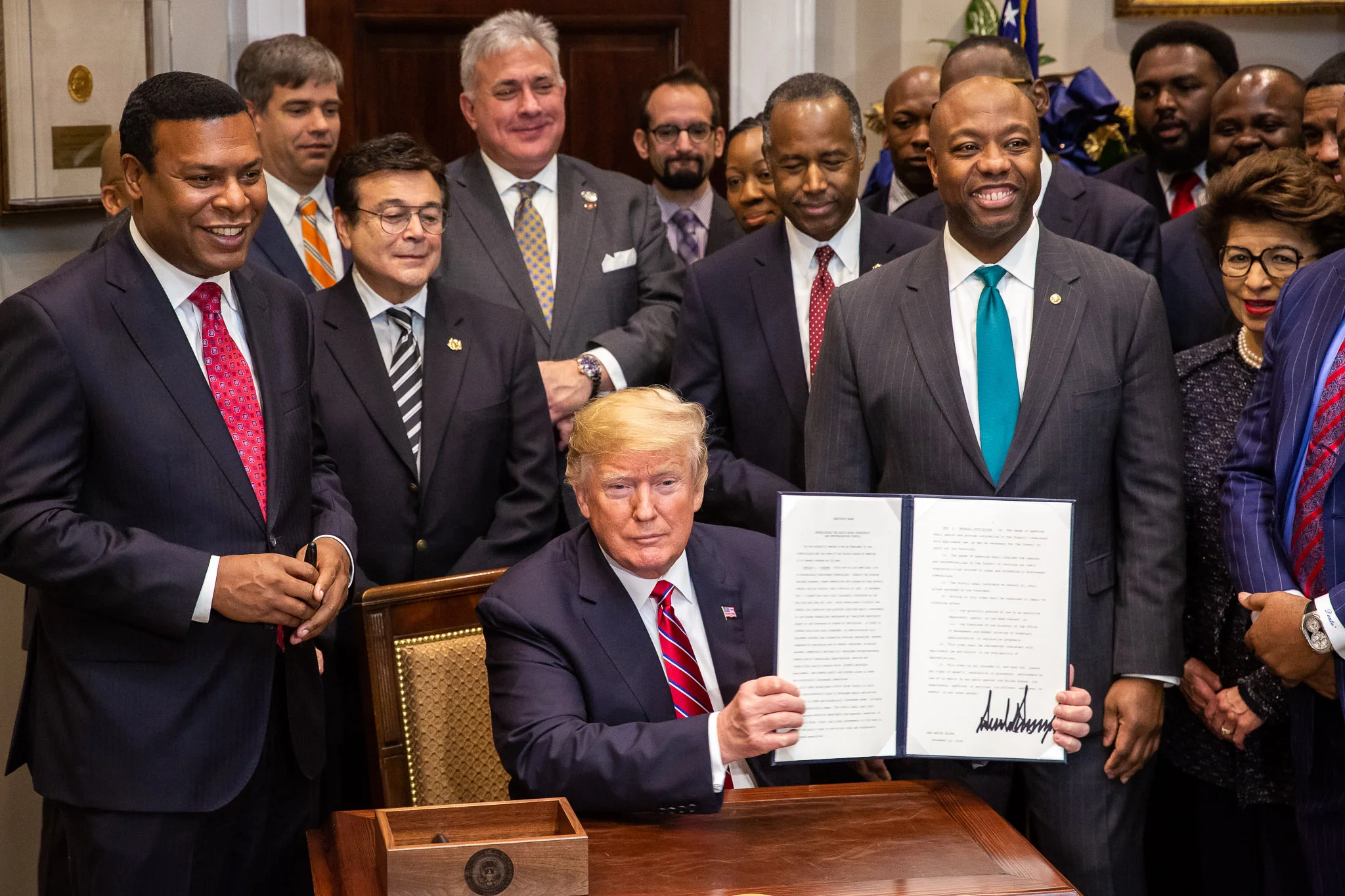 President Trump signs an executive order setting up a White House Opportunity and Revitalization Council. (White House photo by Tia Dufour)