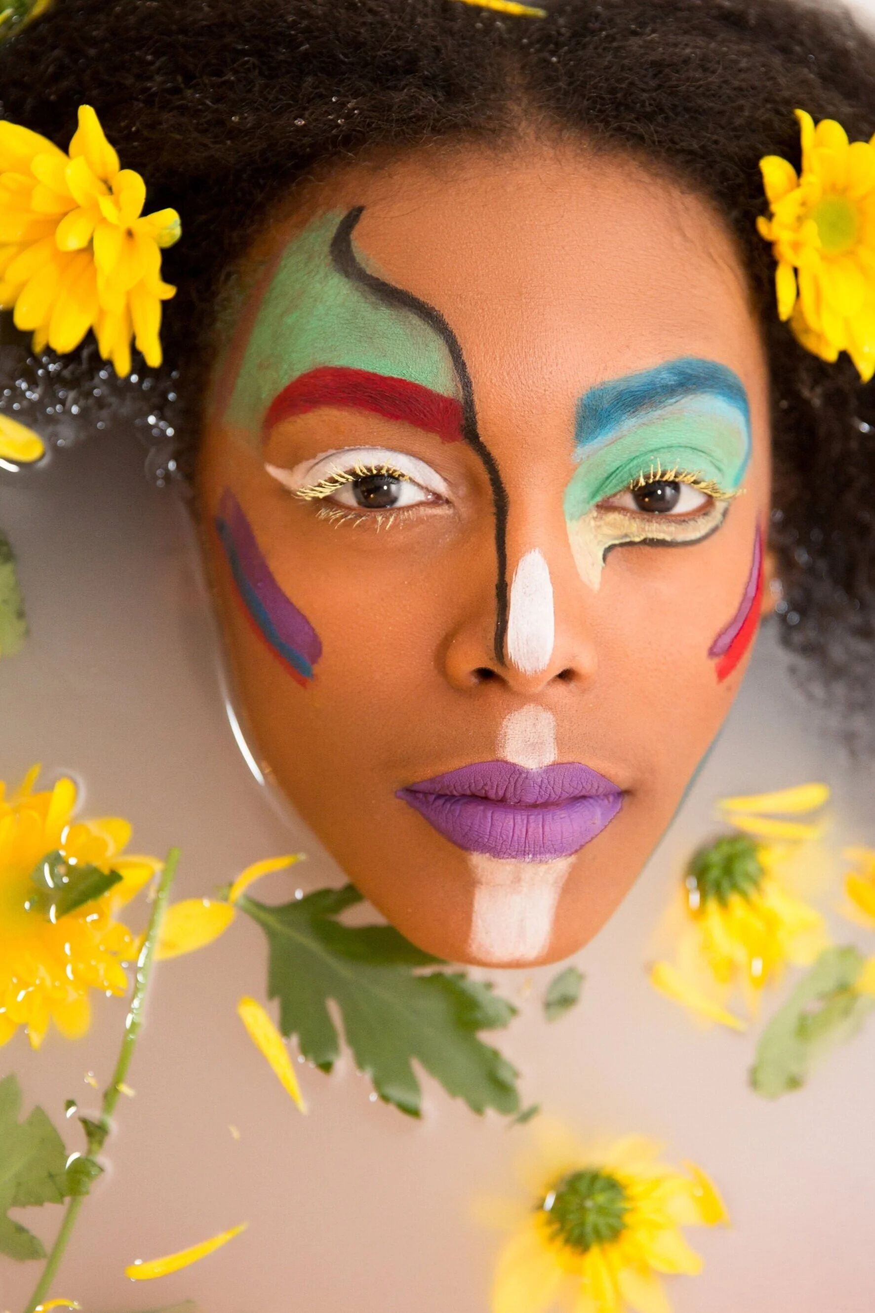 striking face painted in sunflower milk bath