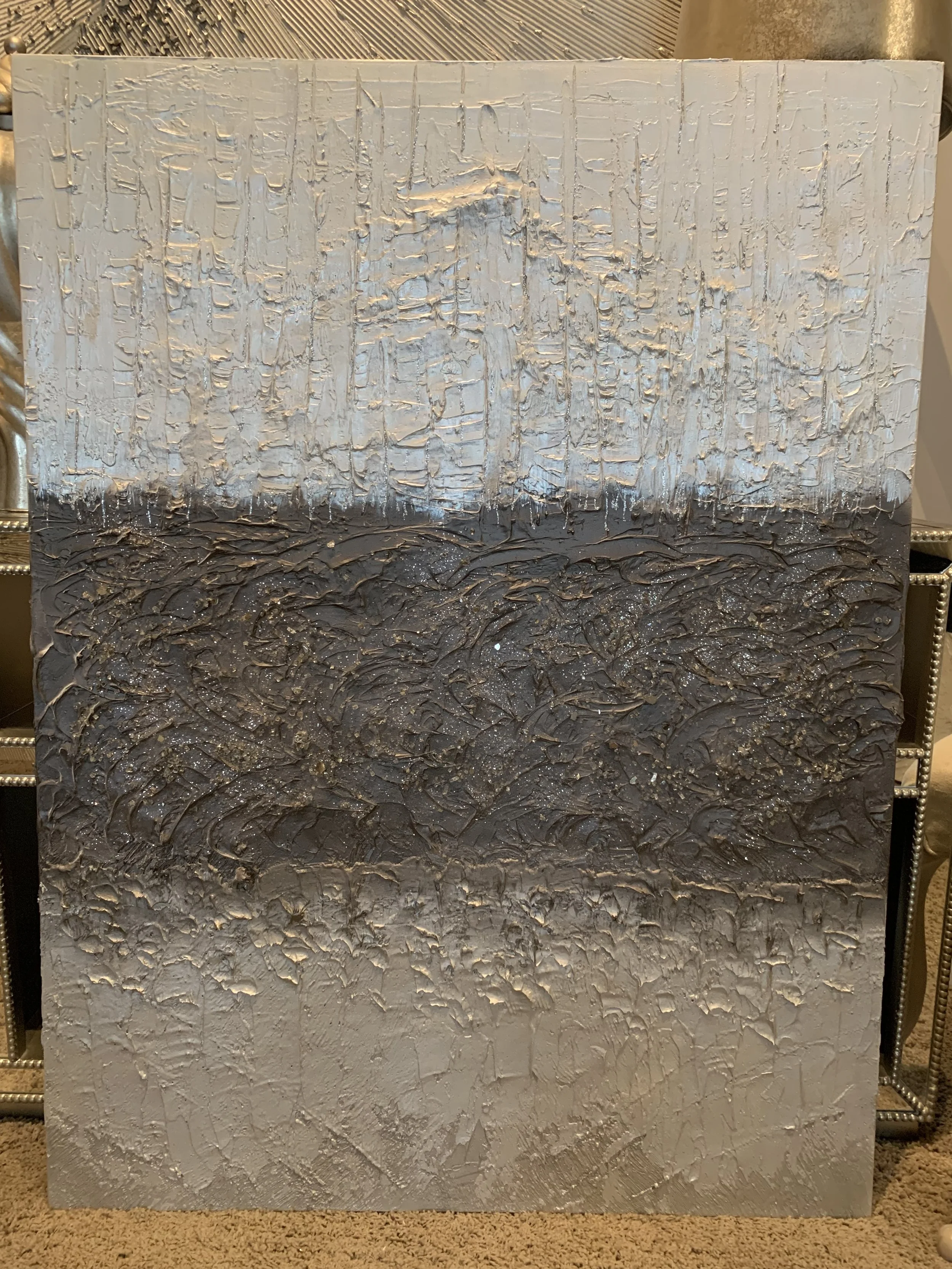 ‘Mastering’ is a 36x48 dramatic piece in diamond white falling into bronze layers falling into silver tones.