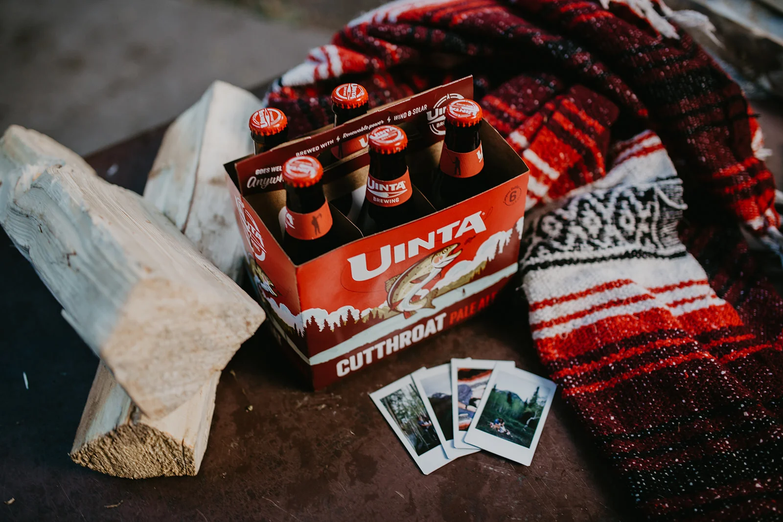 Drinking beer around a camp fire with a couple after their session in Utah