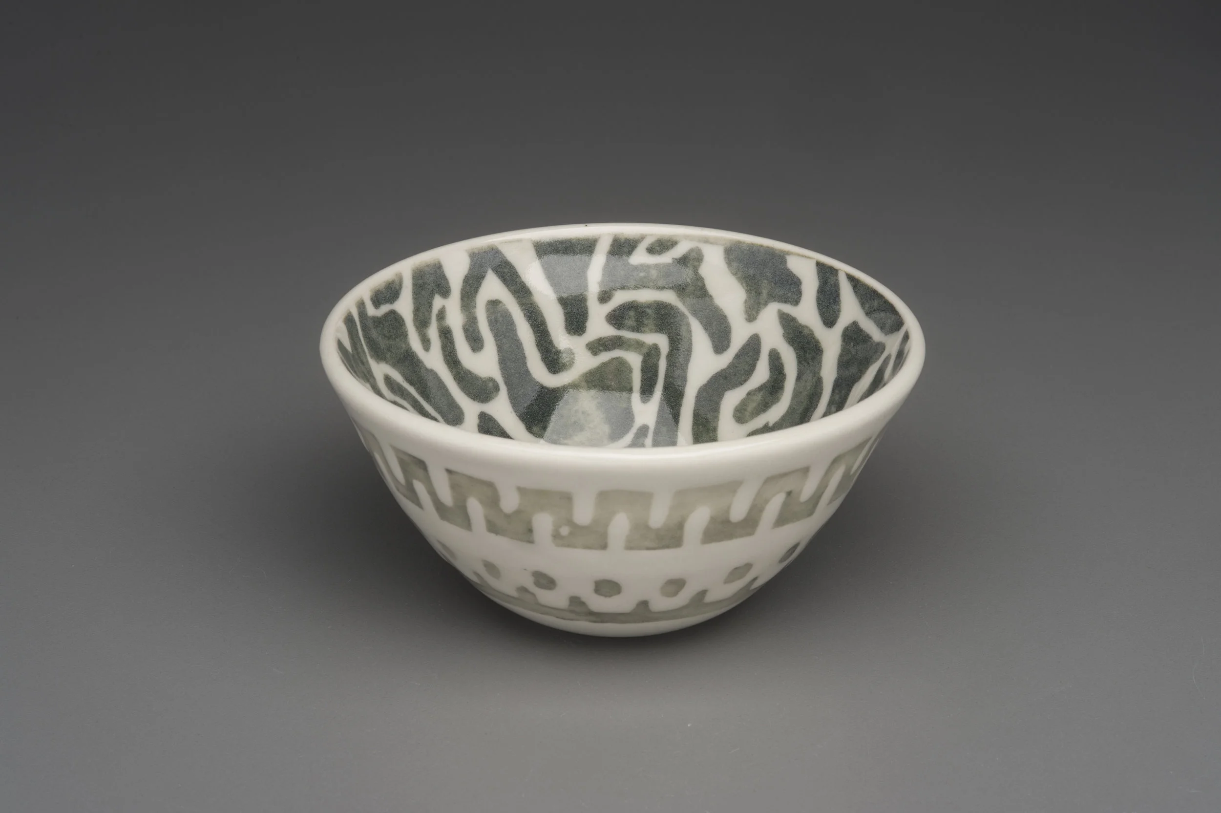  Porcelain water etched tea bowl with celadon glaze