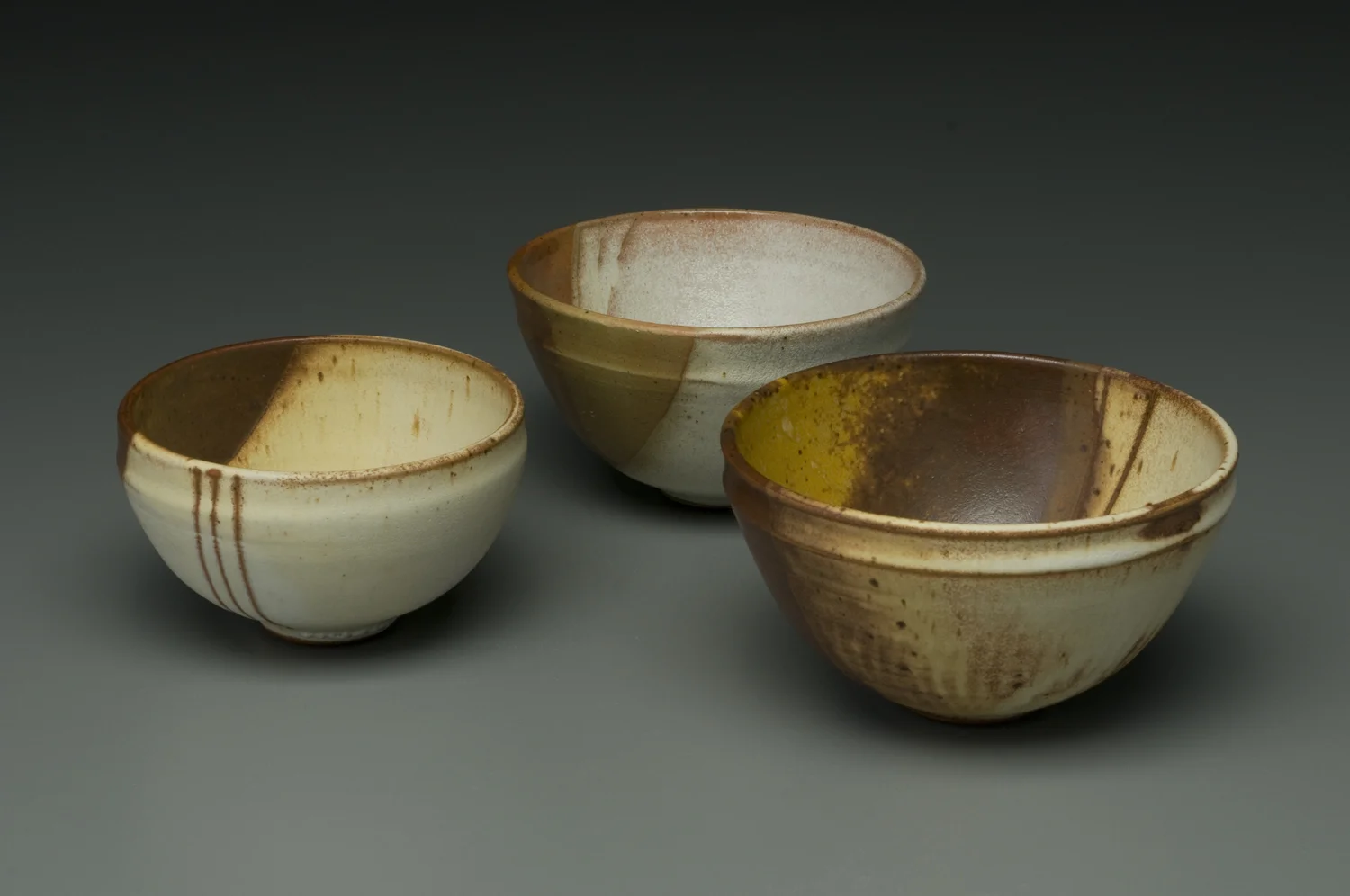  Stoneware bowls with underglaze, spodumene and celadon glazes cone 6-8 reduction. 