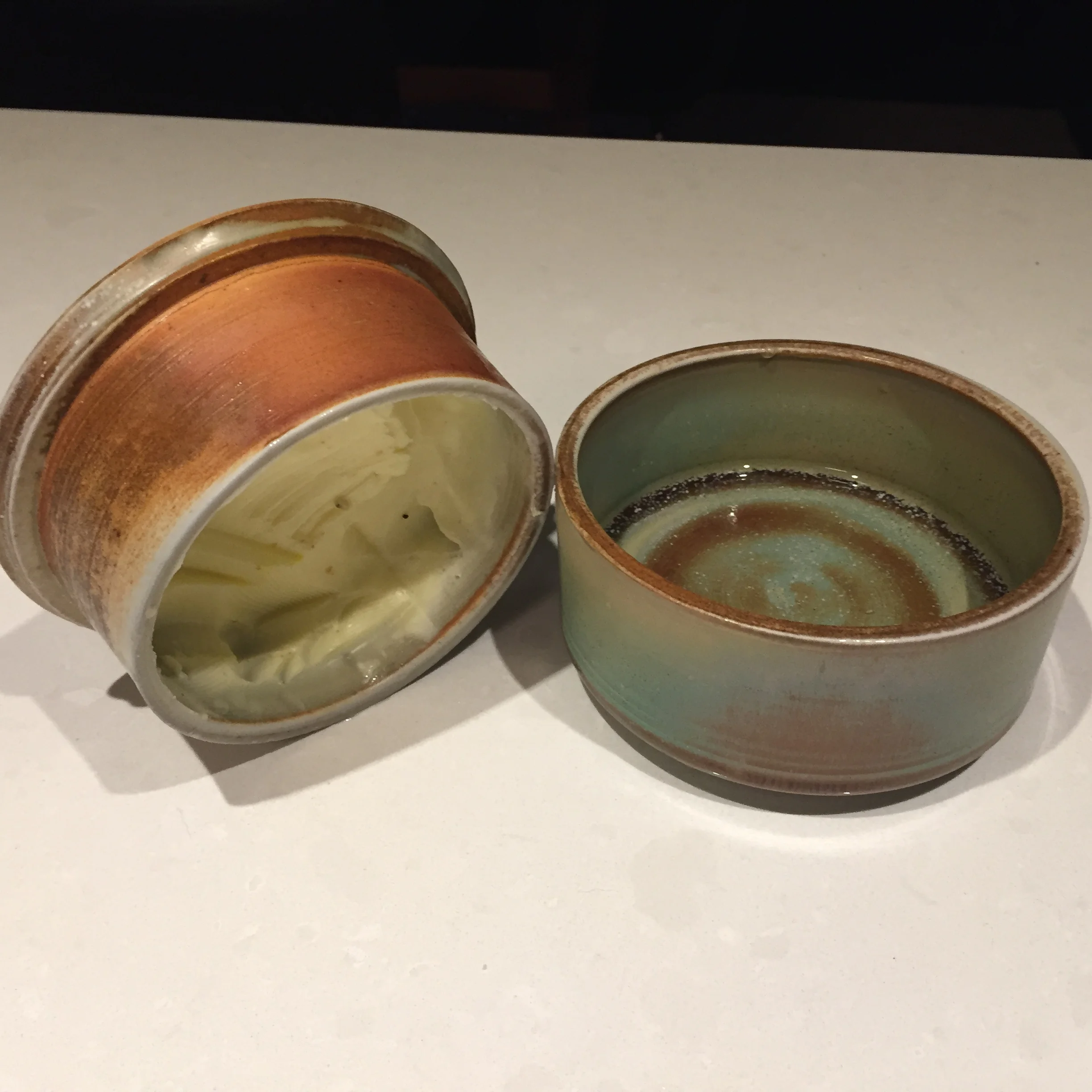  A french butter dish with a dragon green glaze. 