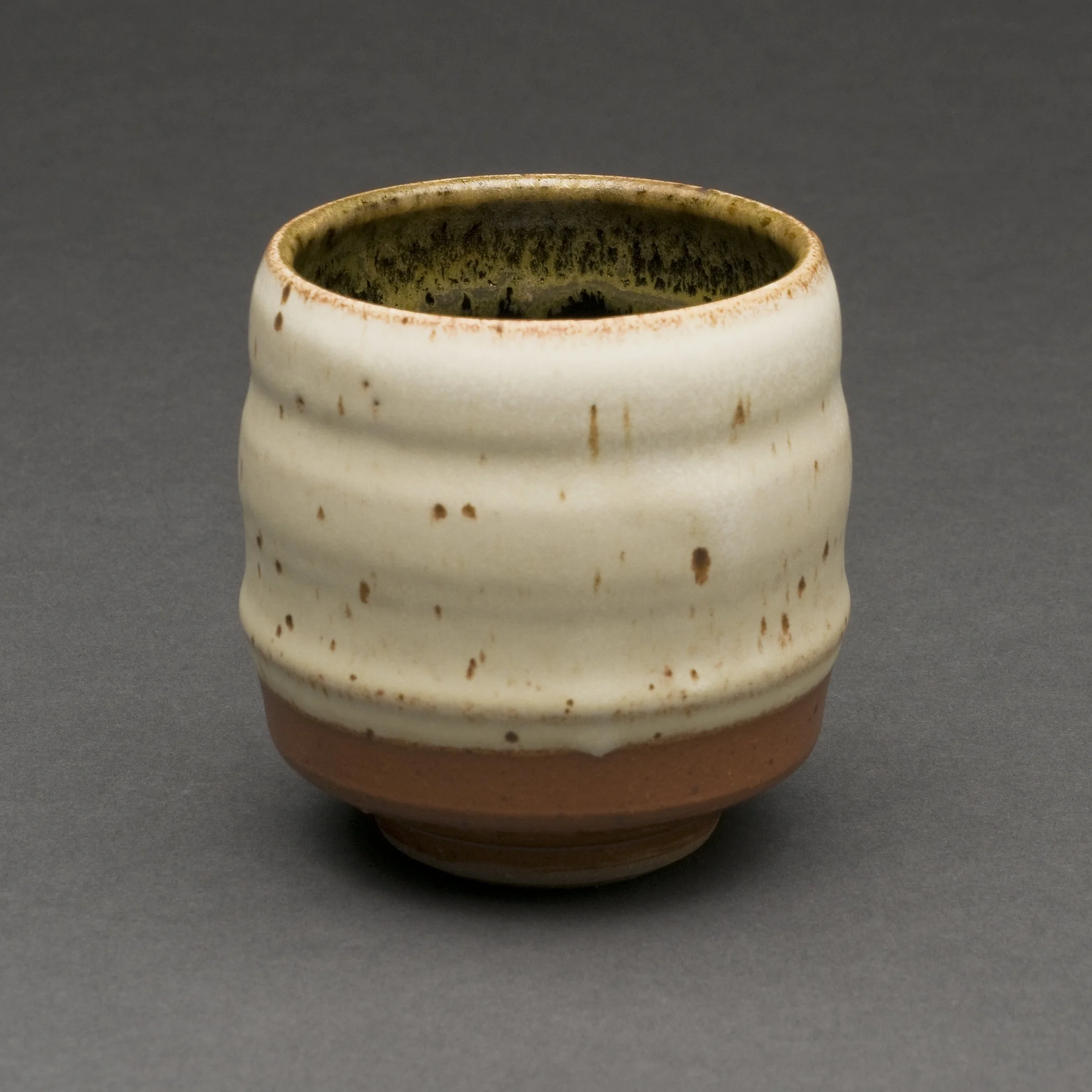 Large stoneware teabowl with temmoku and spodumene glazes, reduction.