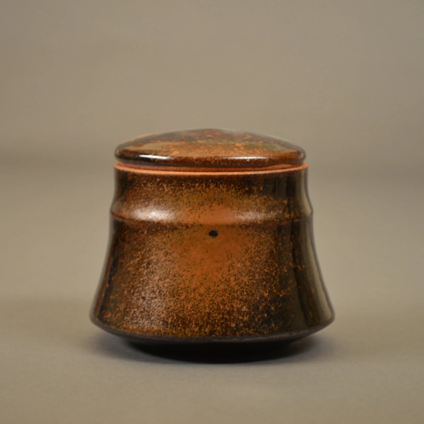  Small stoneware jar with temmoku and rutile glazes. &nbsp;Reduction cone 6-8 