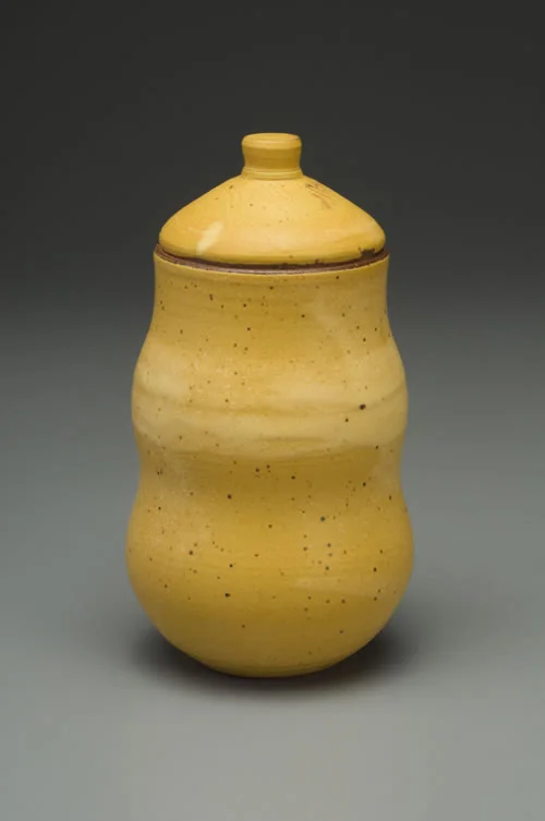 Stoneware jar, woo yellow glaze.